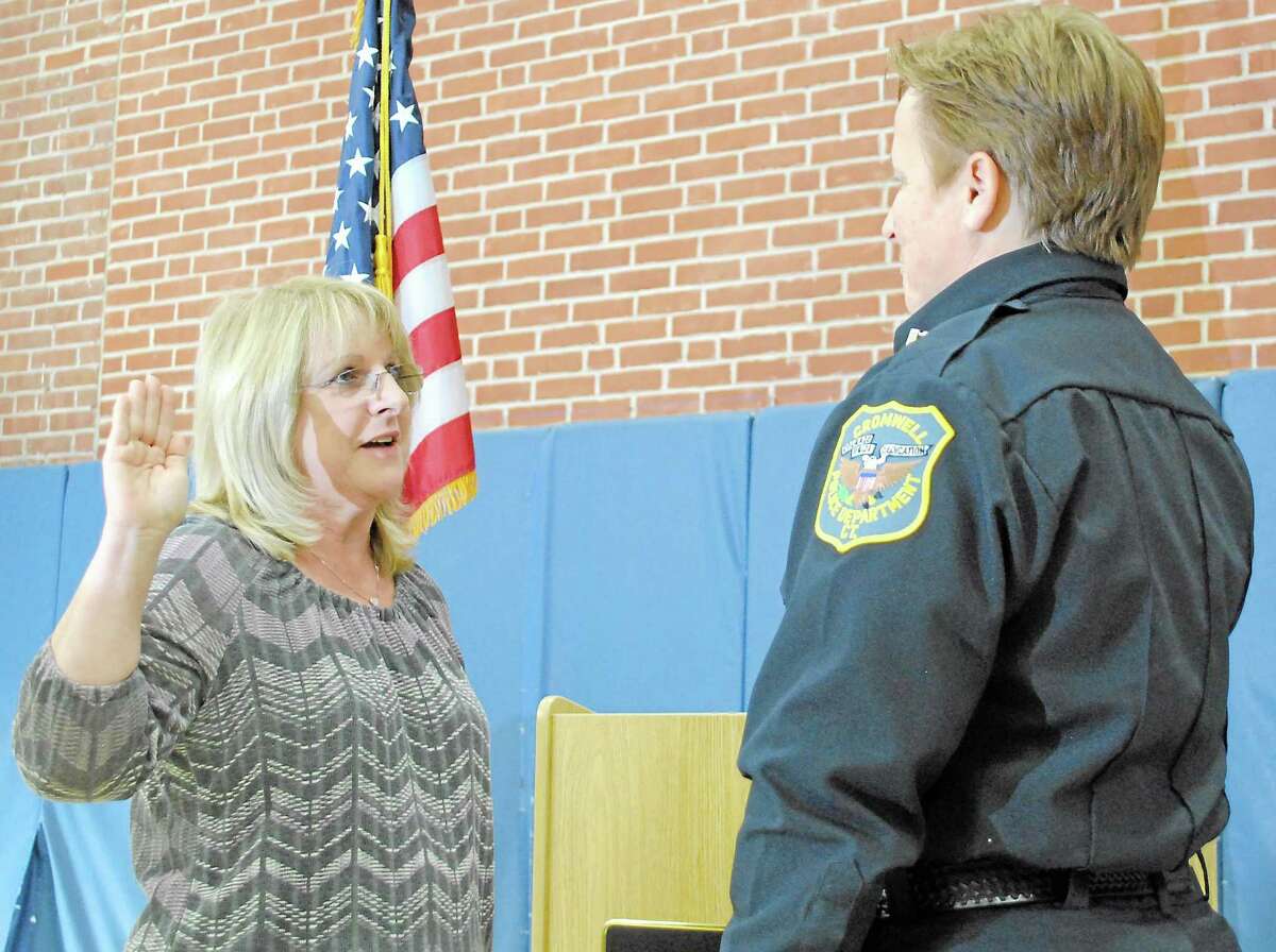 Here, Cromwell Town Clerk Darlene DiProto swears in Cromwell Police Capt. Denise Lamontagne in 2012. She was the municipality’s first woman to earn the rank of captain and will now become chief on Sept. 16.