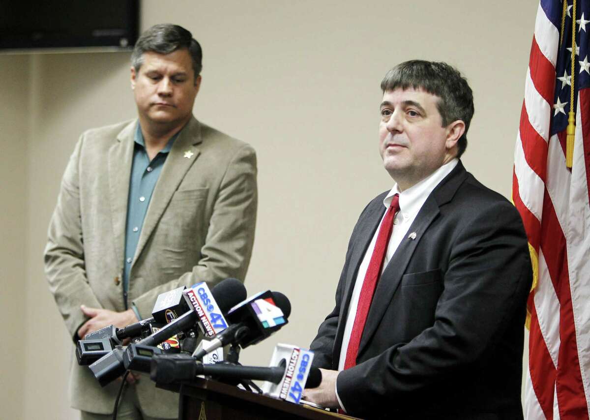 Columbia County State Attorney Jeff Seigmeister speaks during a press conference on Wednesday, Jan. 7, 2015 in Lake City, Fla. about two Columbia County girls accused of killing their brother. Columbia County Sheriff Mark Hunter, left, also spoke. (AP Photo/Matt Stamey, The Gainesville Sun)
