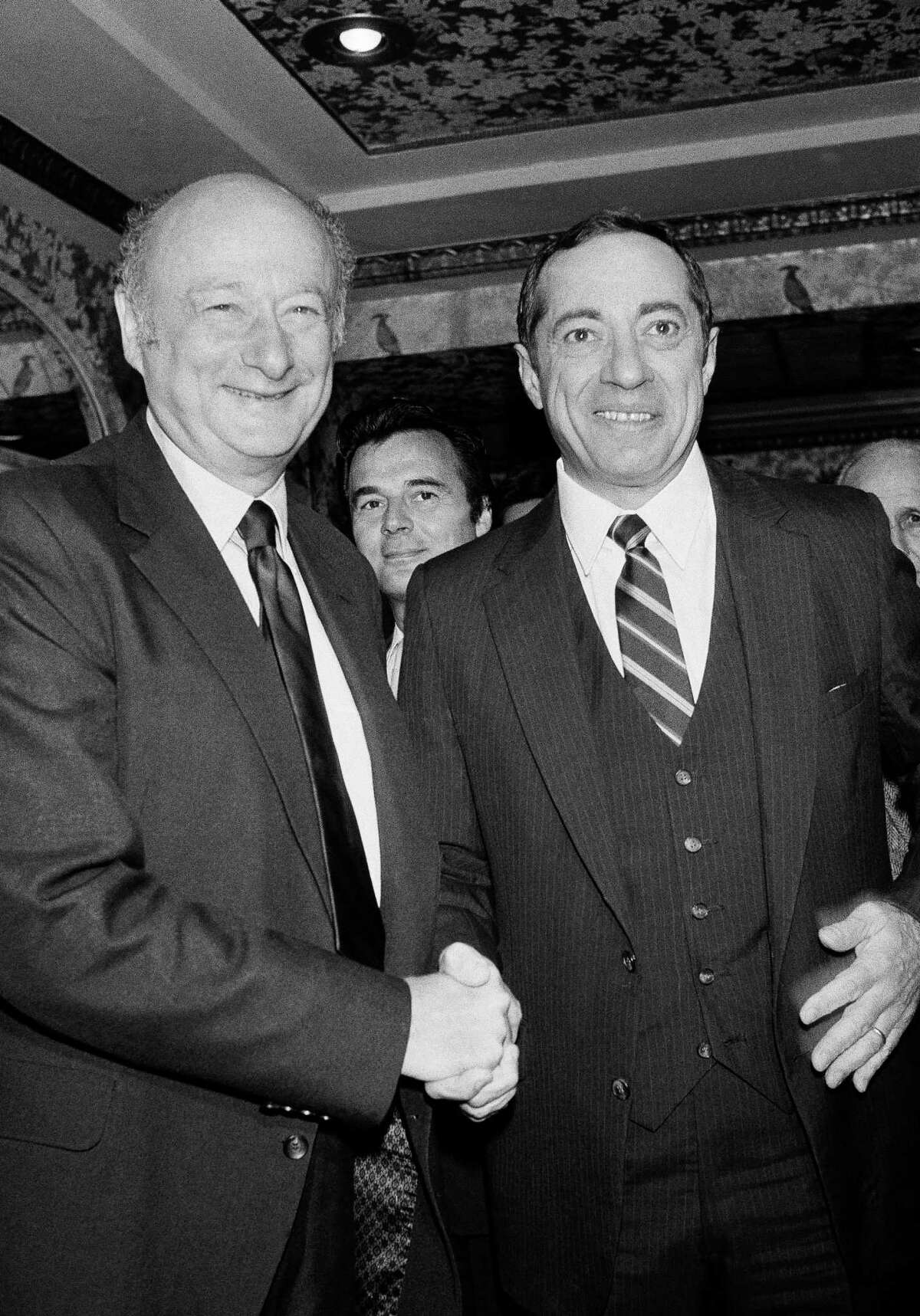 FILE - In this Sept. 21, 1982, file photo, New York Democratic gubernatorial candidates, New York Mayor Edward Koch, left, and New York Lt. Gov. Mario Cuomo, shake hands before starting their debate in New York. Cuomo, a three-term governor of New York, died Thursday, Jan. 1, 2015, the day his son Andrew started his second term as governor, the New York governor’s office confirmed. He was 82.