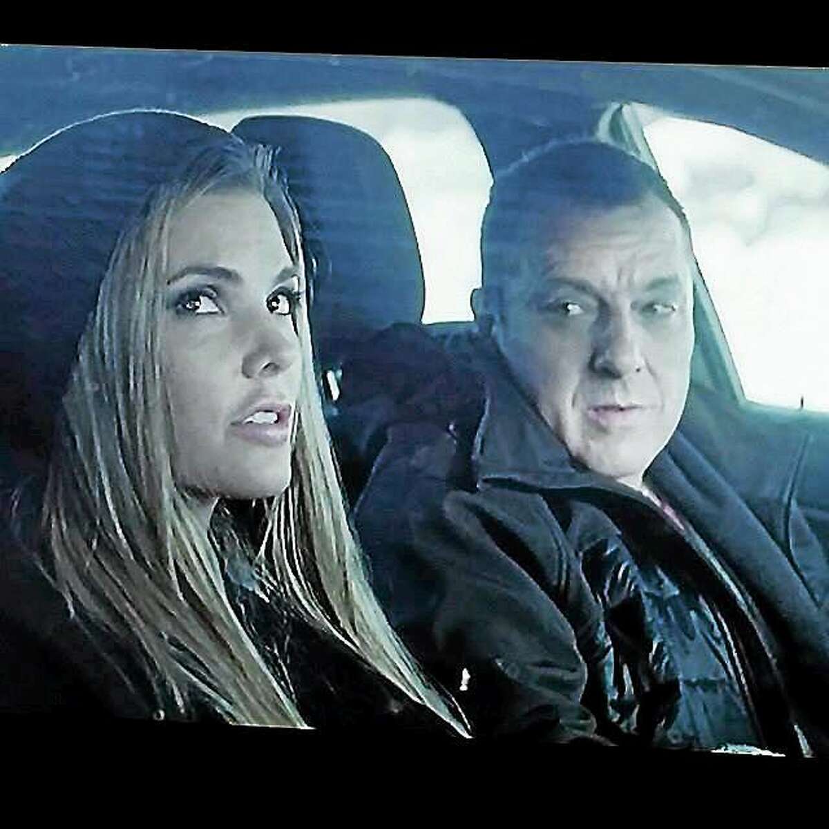 Actor Tom Sizemore and actress Nikki Moore are shown during a scene from the feature film, “Blue Line.”