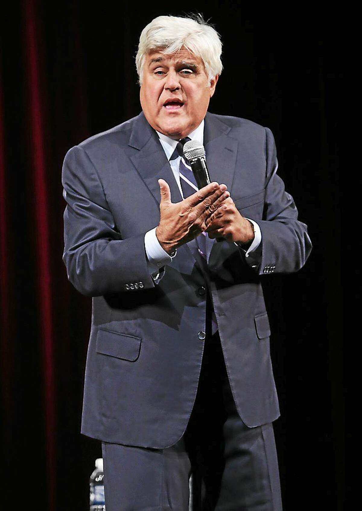 Photo by John Atashian Comedian and television host Jay Leno is shown performing on stage during his sold out concert appearance at the Jorgenson Center for the Performing Arts in Storrs on Sept. 20.