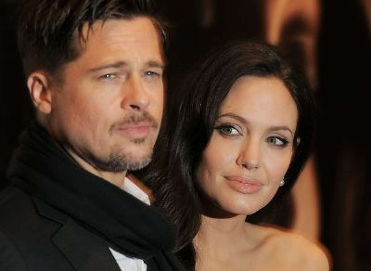 Actor Brad Pitt and actress Angelina Jolie attend a New York Film Festival screening of "Changeling" at the Ziegfeld Theatre on Saturday, Oct. 4, 2008 in New York. (AP Photo/Evan Agostini)