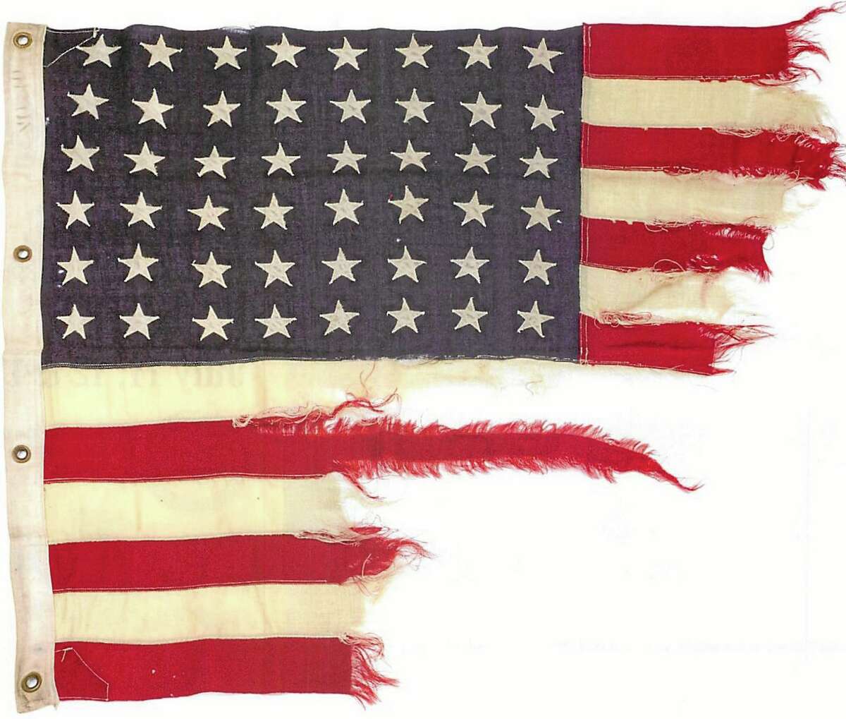 This photo provided by collector Rodney Hilton Brown shows a tattered 48-star American flag that flew aboard the U.S.-built LST 493 on D-Day that is being auctioned by Bonhams in New York on Thursday, June 5, 2014. The flag is among the hundreds of D-Day and other World War II artifacts being auctioned a day before the 70th anniversary of the history-changing invasion. The auction also features rare print-outs of the original series of hourly Dow Jones news bulletins with some of the first reports of the fighting on Franceís north coast on June 6, 1944. (AP Photo/Courtesy of Rodney Hilton Brown)