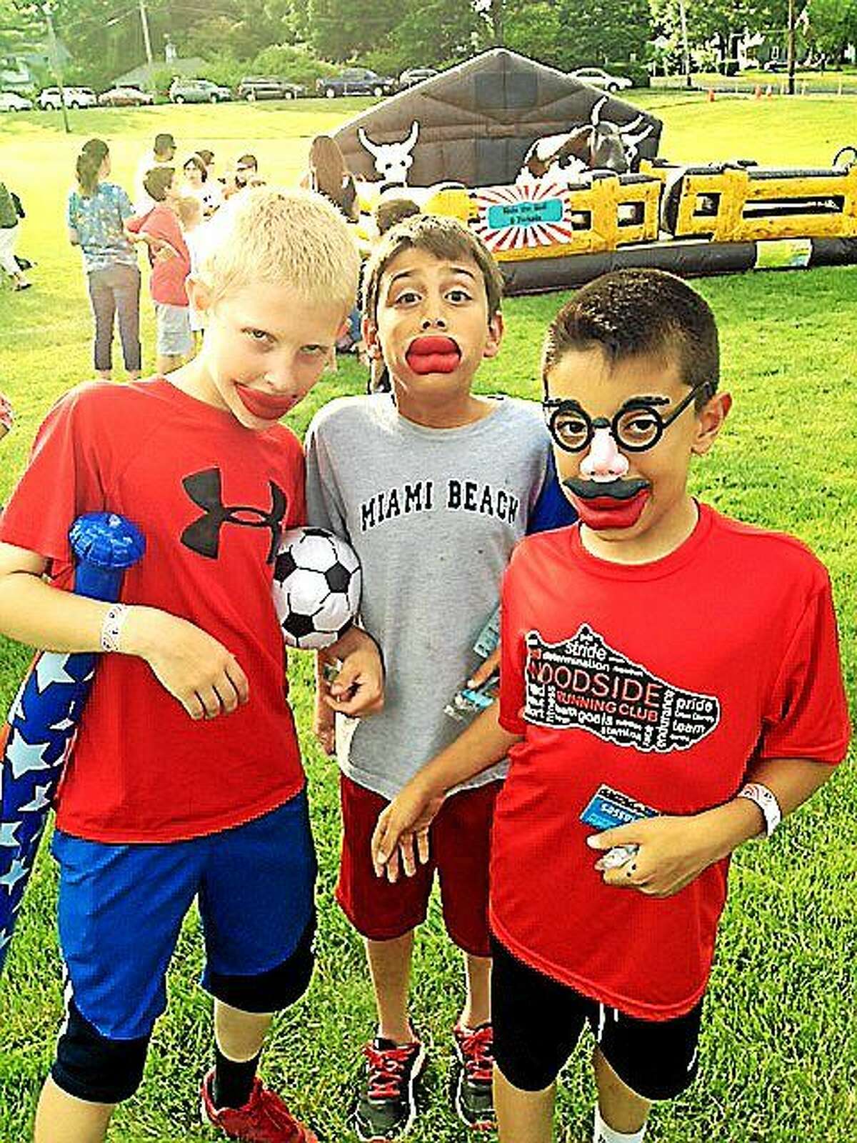 Cromwell students Michael Drazak, Logan Fox and Austin Antanaras enjoy the festivities during last year’s end of school party-fundraiser.