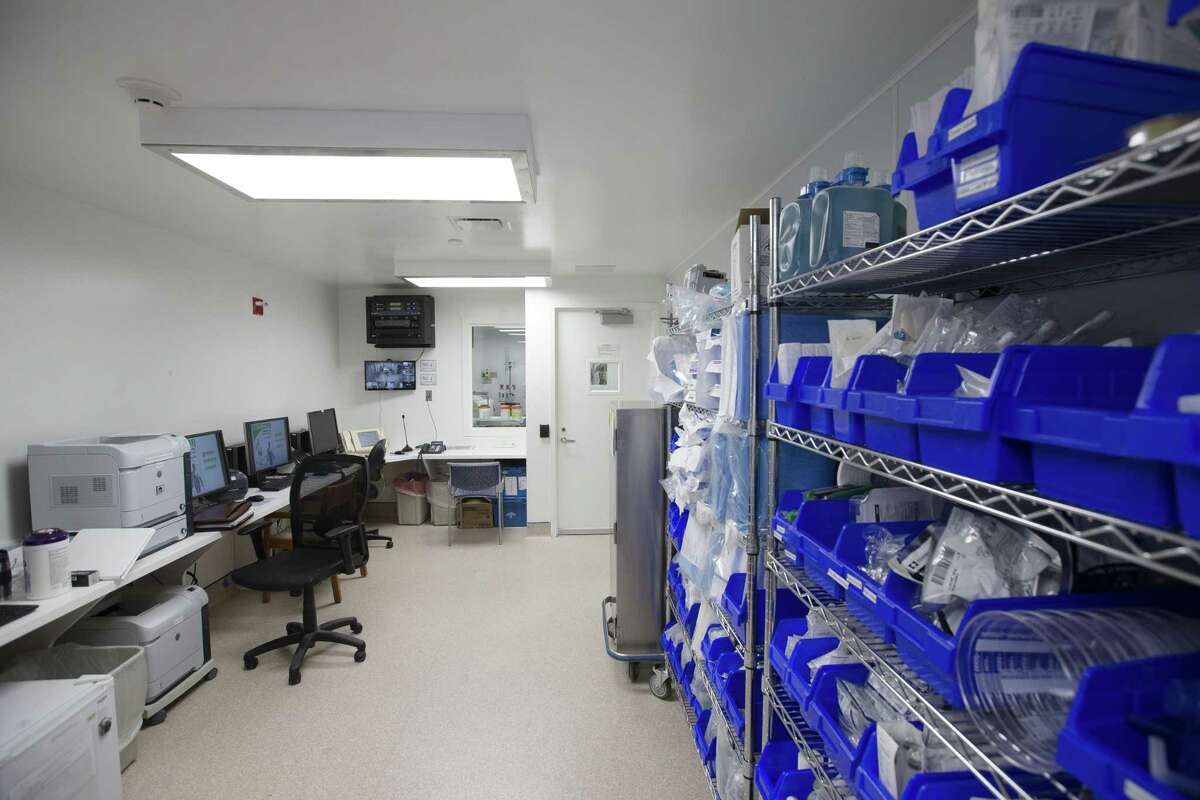 In this Friday, Nov. 14, 2014 photo, selves of medical equipment are stocked in the monitoring room inside a new custom-built bio-containment unit for potential Ebola cases at Mount Sinai Hospital, in New York. The unit, built over two weeks, is completely separate from the main medical buildings and can house three patients simultaneously. (AP Photo/John Minchillo)