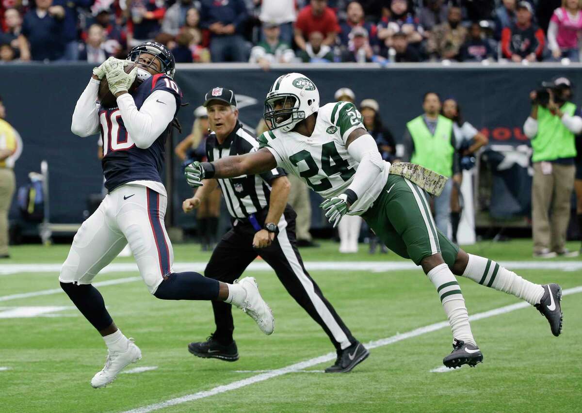 Texans receiver DeAndre Hopkins burns Jets cornerback Darrelle Revis for a touchdown on Sunday in Houston.