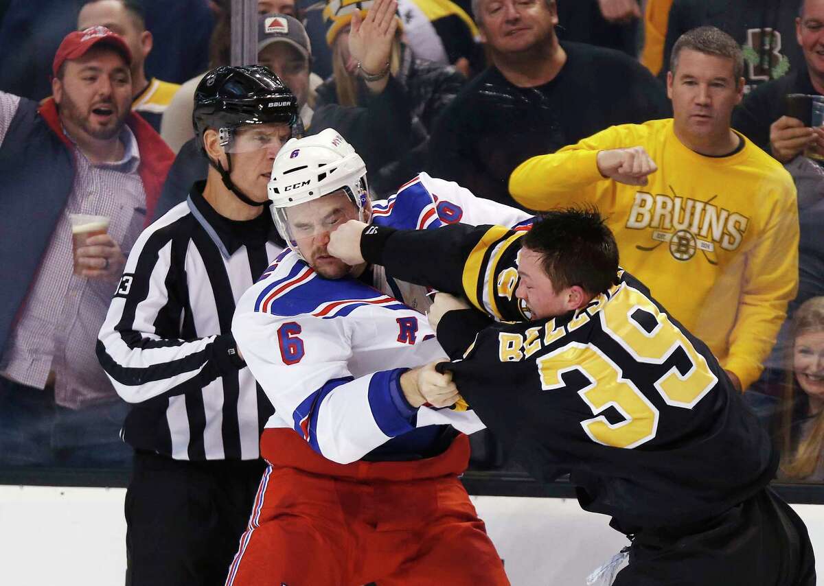 The Rangers’ Dylan McIlrath (6) and Bruins’ Matt Beleskey fight during the second period of Boston’s 4-3 win on Friday.