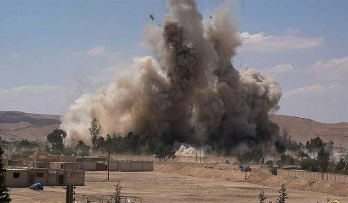FILE - This photo released on Saturday, May 30, 2015 by a militant website, which has been verified and is consistent with other AP reporting, shows Tadmur prison, blown up and destroyed by the Islamic State group in Palmyra (Tadmur in Arabic), Homs province, Syria. The prison was where government opponents were held, and reports over the years said it was the site of beatings and torture. (Militant website via AP, File)