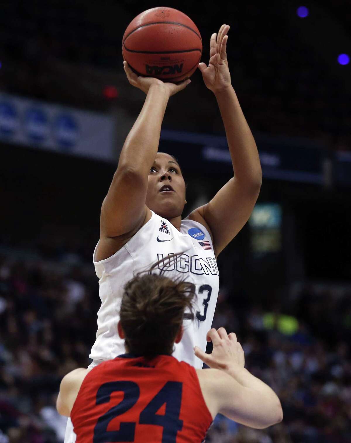 Connecticut forward Kaleena Mosqueda-Lewis (23) shoots over Dayton guard Andrea Hoover (24) during the first half of a regional final game in the NCAA women's college basketball tournament Monday, March 30, 2015, in Albany, N.Y. (AP Photo/Mike Groll)