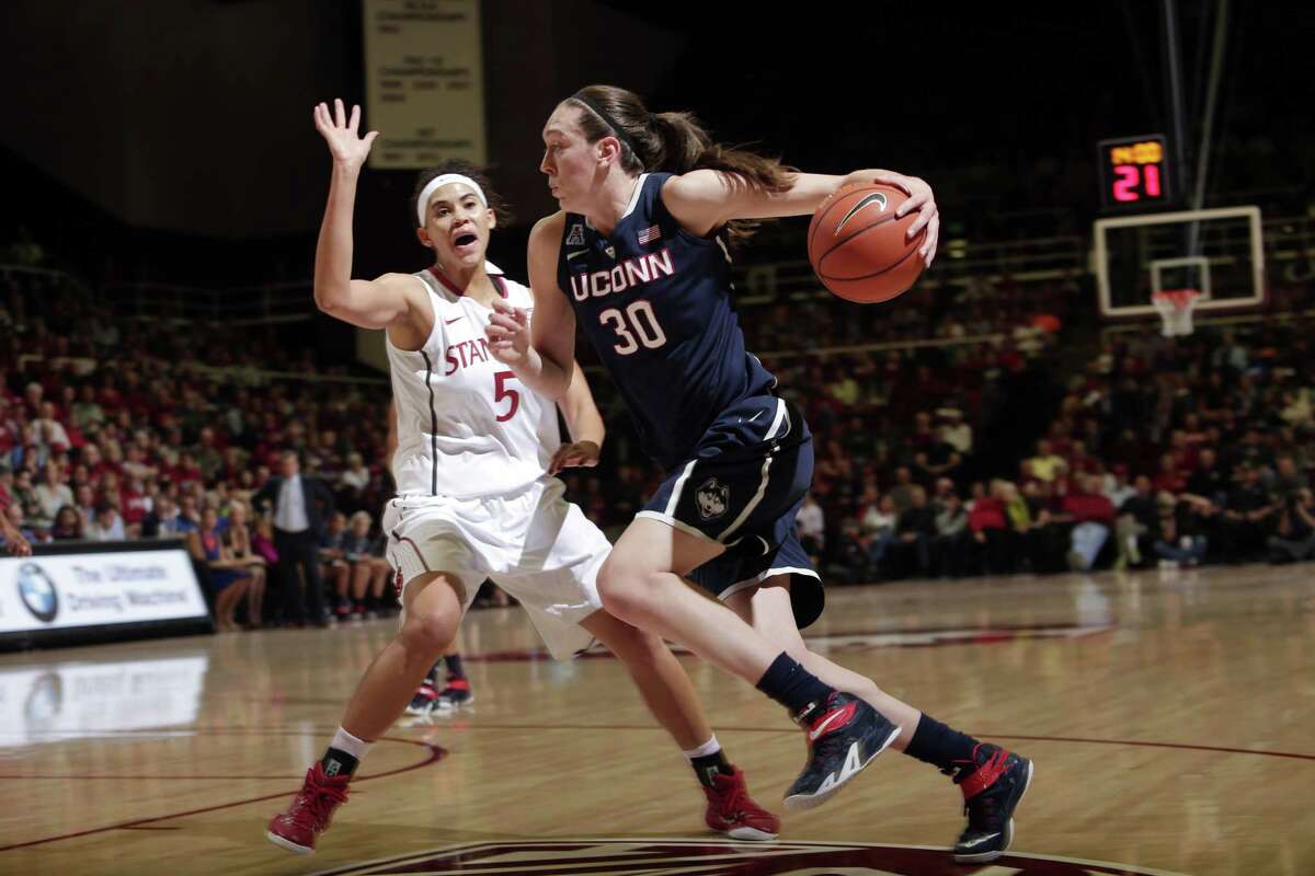 UConn forward Breanna Stewart, right, dribbles next to Stanford forward Kaylee Johnson during the Huskies’ loss to the Cardinal on Nov. 17 in Stanford, Calif.
