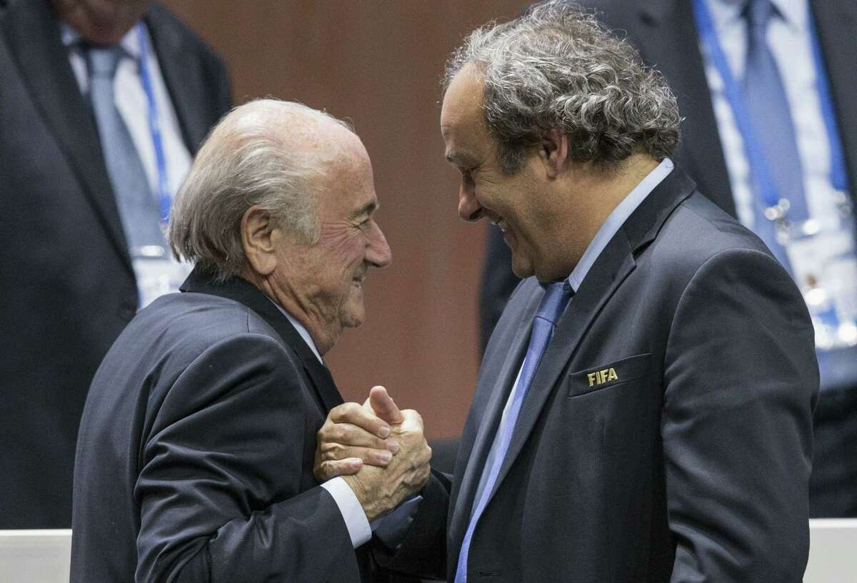 FIFA president Sepp Blatter, left, says he will resign.