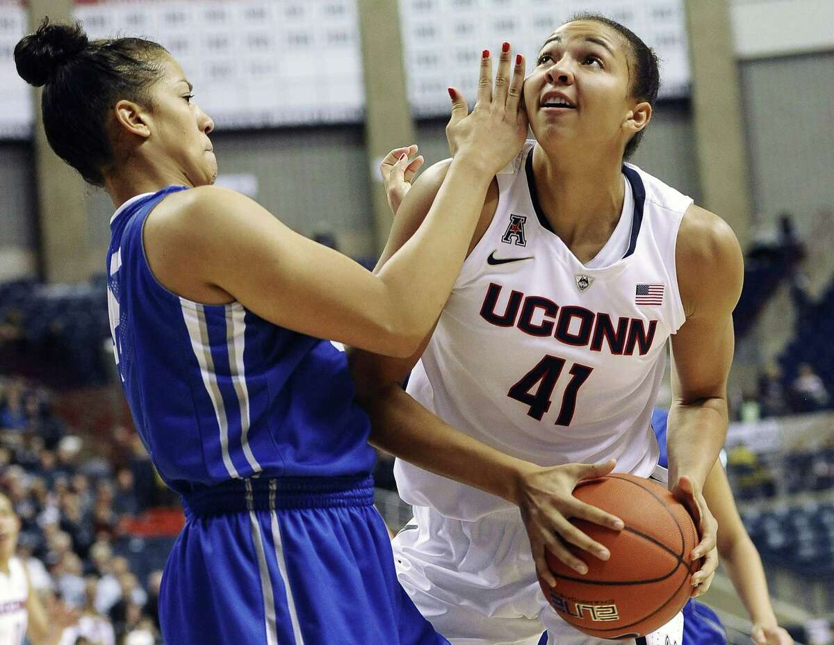 UConn’s Kiah Stokes, right, looks to shoot as Creighton’s Alexis Akin-Otiko defends during the second half of the No. 3 Huskies’ 96-60 win on Sunday in Storrs.