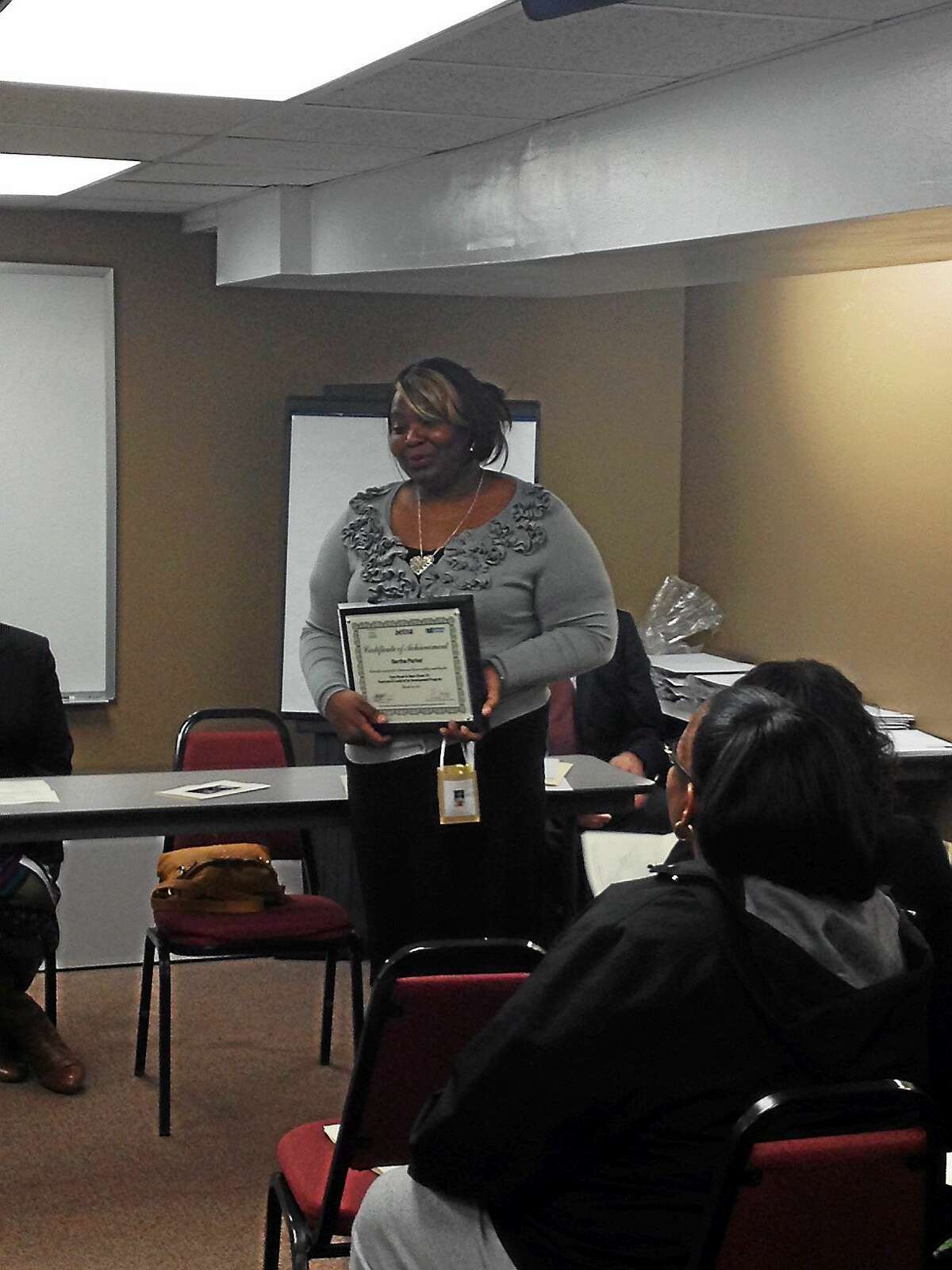 Bertha Parker speaks at her graduation from the 18th class of the Side Street to Main Street program.