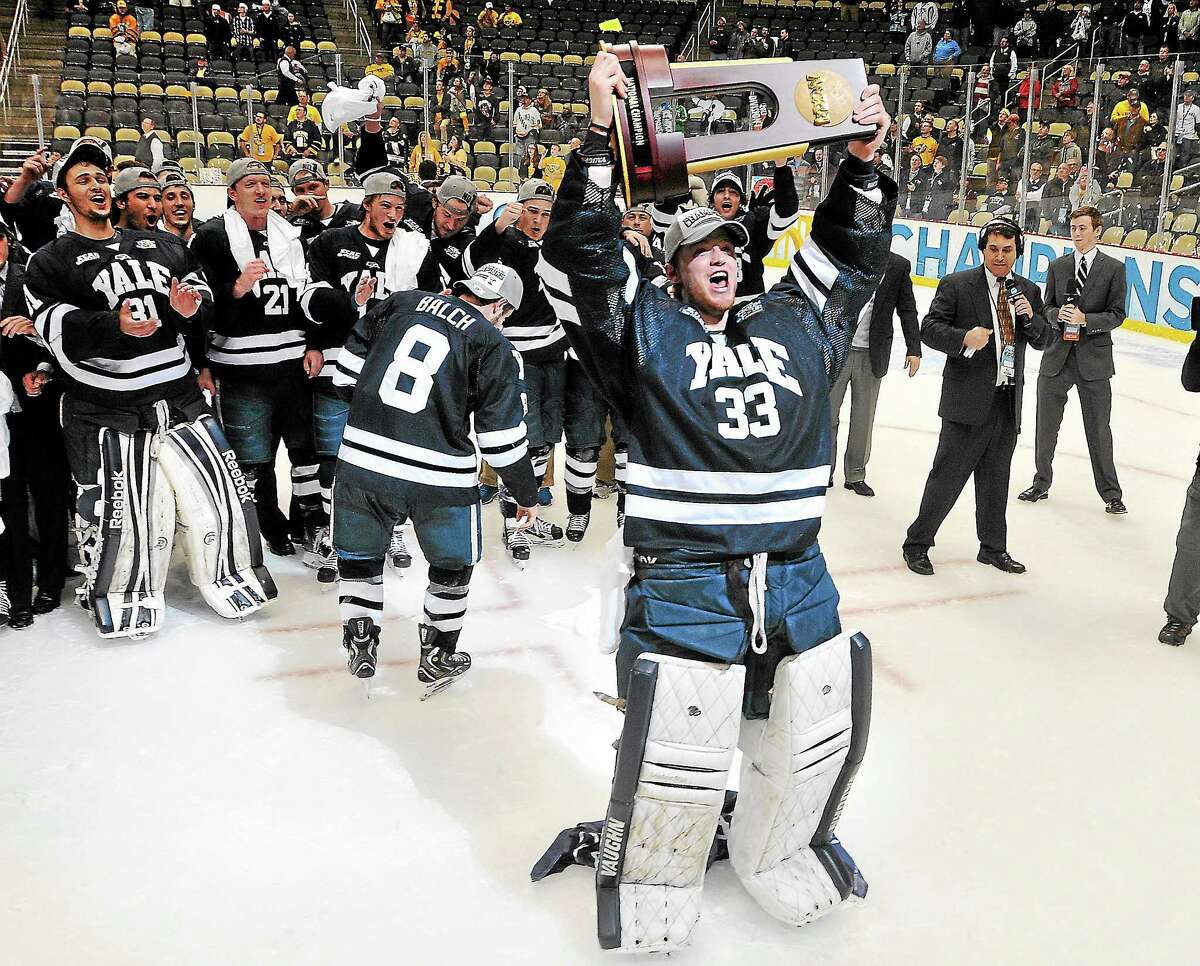 Yale celebrates its victory over Quinnipiac in the national championship game last April in Pittsburgh. The fourth-ranked Bobcats and 13th-ranked Bulldogs meet for the second time this season Friday night at Ingalls Rink. They tied 3-3 on Nov. 9 in Hamden.