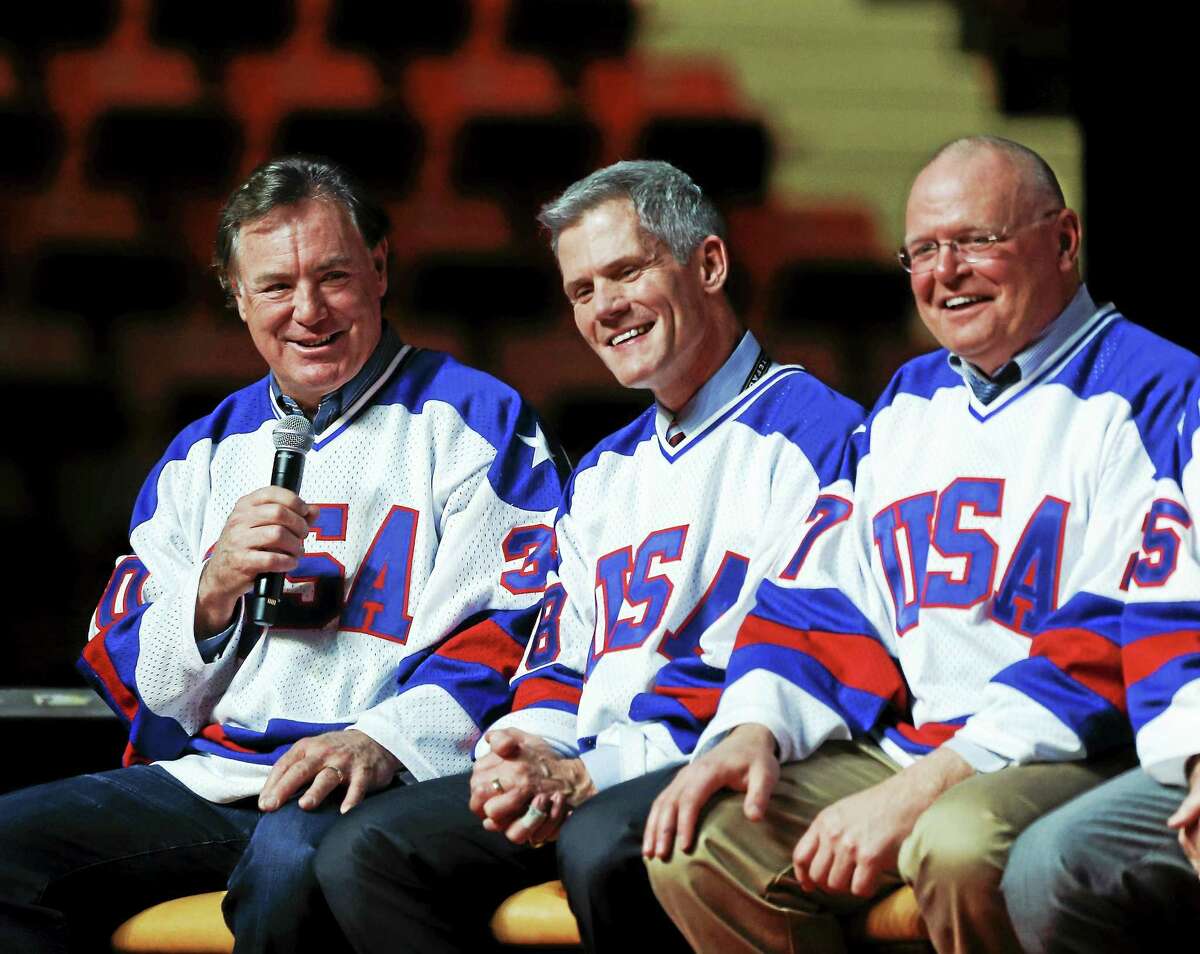 Jim Craig, left, of the 1980 U.S. hockey team, speaks during a “Relive the Miracle” reunion at Herb Brooks Arena on Feb. 21 in Lake Placid, N.Y.