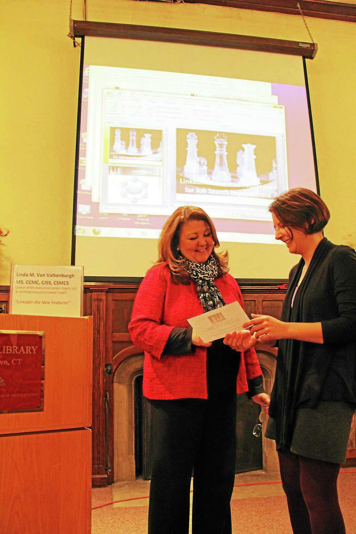Linda Van Valkenburgh, left, reviews her agenda with Lindsay Riordan, Russell Library’s business and career resources librarian.