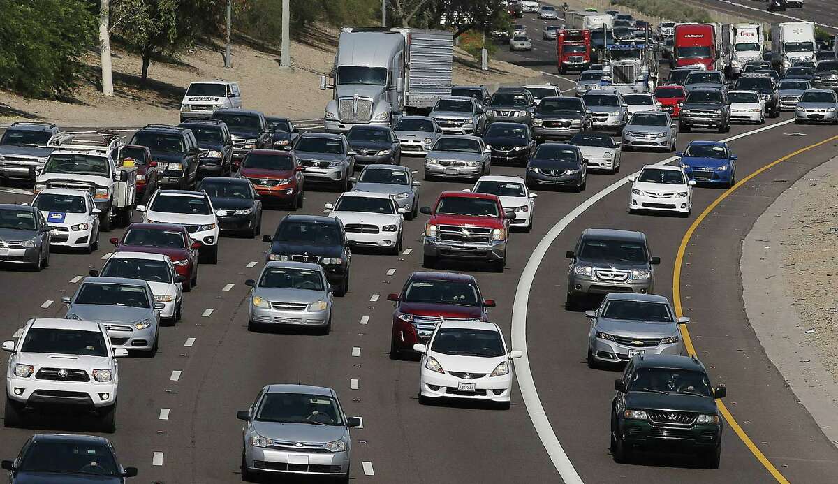 FILE - In this June 24, 2015, file photo, afternoon rush our traffic moves along a highway in Phoenix. The average vehicle in the U.S. is now a record 11.5 years old, according to consulting firm IHS Automotive, a sign of the increased reliability of today’s vehicles and the lingering impact of the sharp drop in new car sales during the recession.