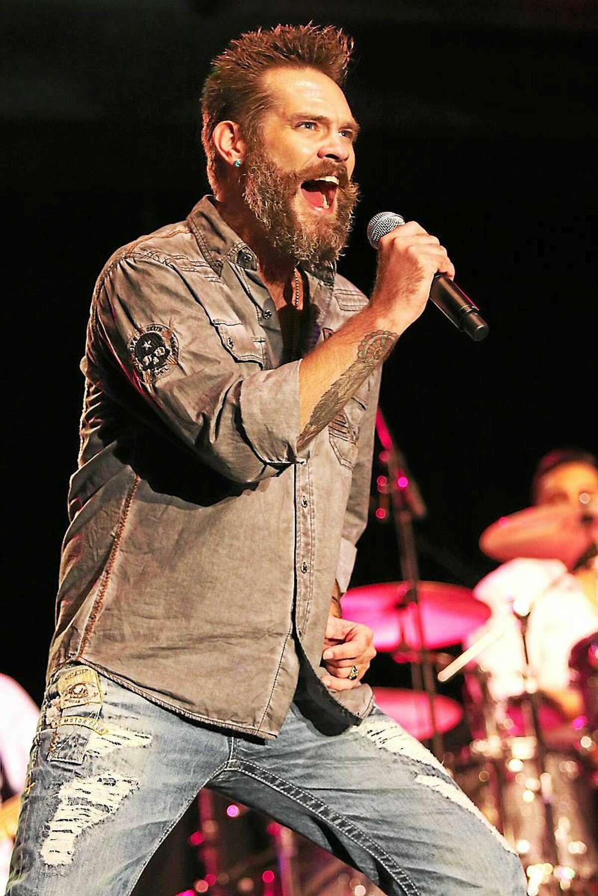 Photo by John Atashian Singer Bo Bice is shown performing on stage along with Blood, Sweat & Tears during the bandís concert at the Connecticut Convention Center in Hartford on July 24th. Also included in the double bill show was Jefferson Starship.
