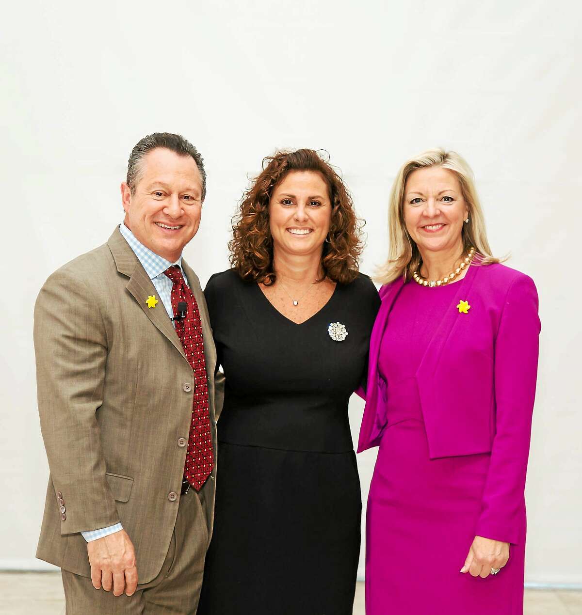From left, Gino Blefari joins top producer Julianne Ward, who was honored by Berkshire Hathaway HomeServices New England Properties' CEO and president Candace Adams at the company's recent breakfast event.