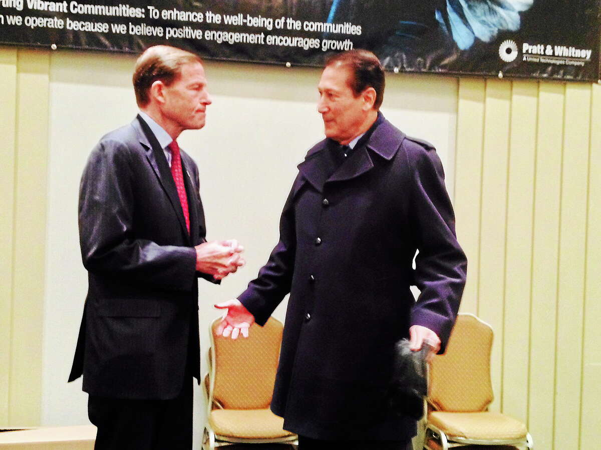 Michael T. Lyle Jr. - The Middletown Press Sen. Richard Blumenthal speaks with Middletown City Councilman Tom Serra at the Middlesex County Chamber of Commerce breakfast session Monday in Cromwell.