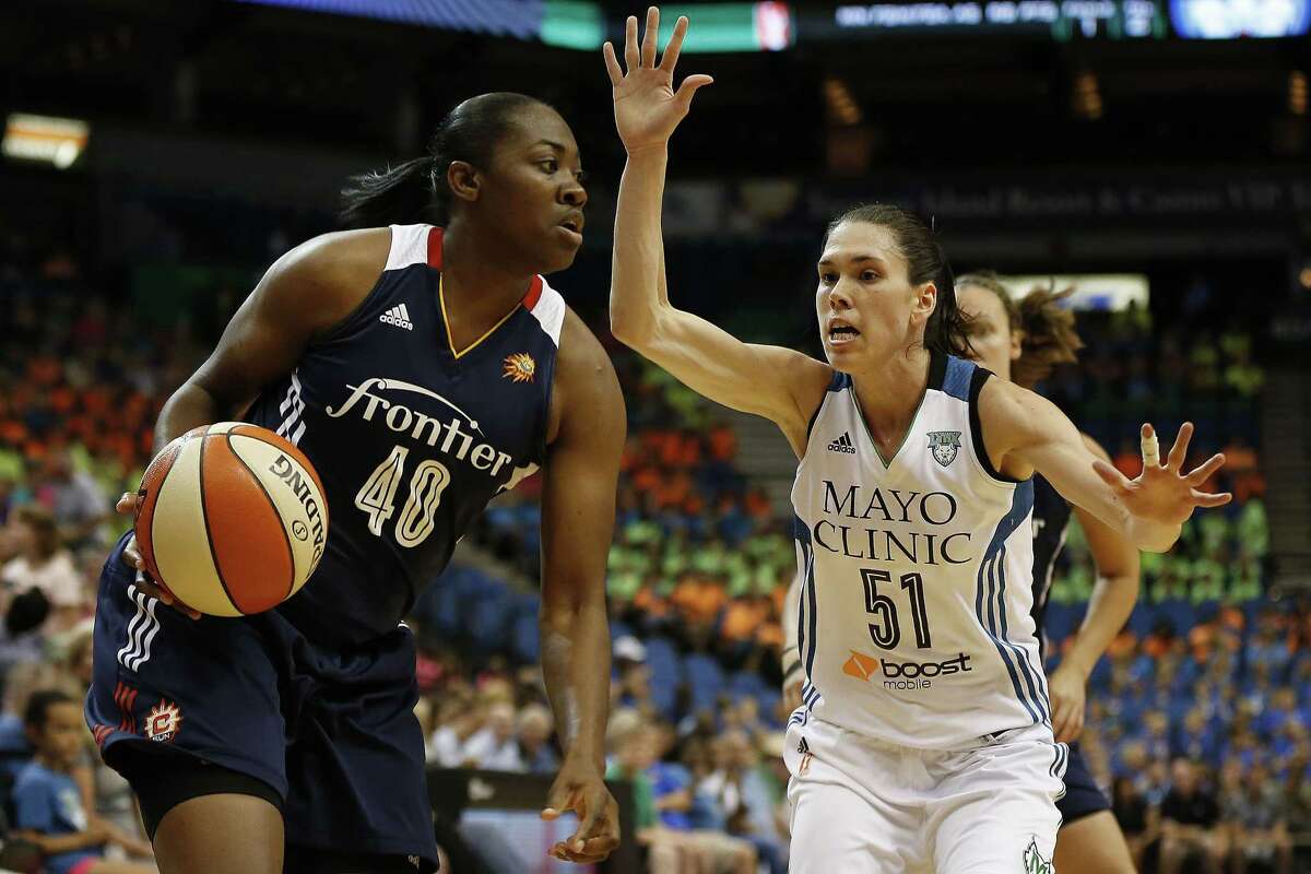 Connecticut forward Shekinna Stricklen, left, drives by Minnesota Lynx guard Anna Cruz during the Sun’s 78-77 overtime victory on Wednesday afternoon in in Minneapolis.