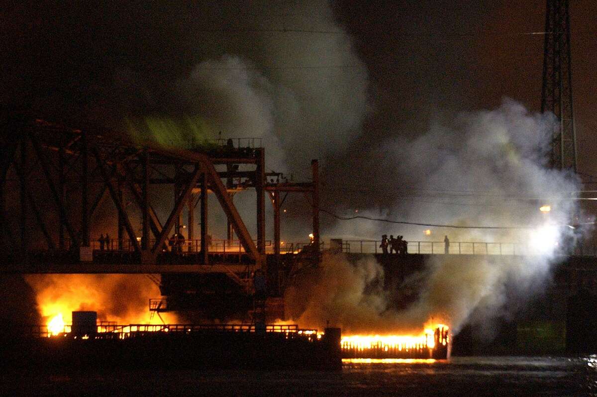 FILE -- In this May 12, 2005, photo, a portal bridge burns after a fast-moving fire engulfed the railroad bridge, disrupting New Jersey Transit and Amtrak service on the Northeast Corridor. A plan to replace the bridge has pushed forward and could be finished in less than four years _ provided about $940 million can be found to complete the project. Amtrak and New Jersey Transit carry between 150,000 and 200,000 people across the bridge each day. (AP Photo/Bill Kostroun, File)