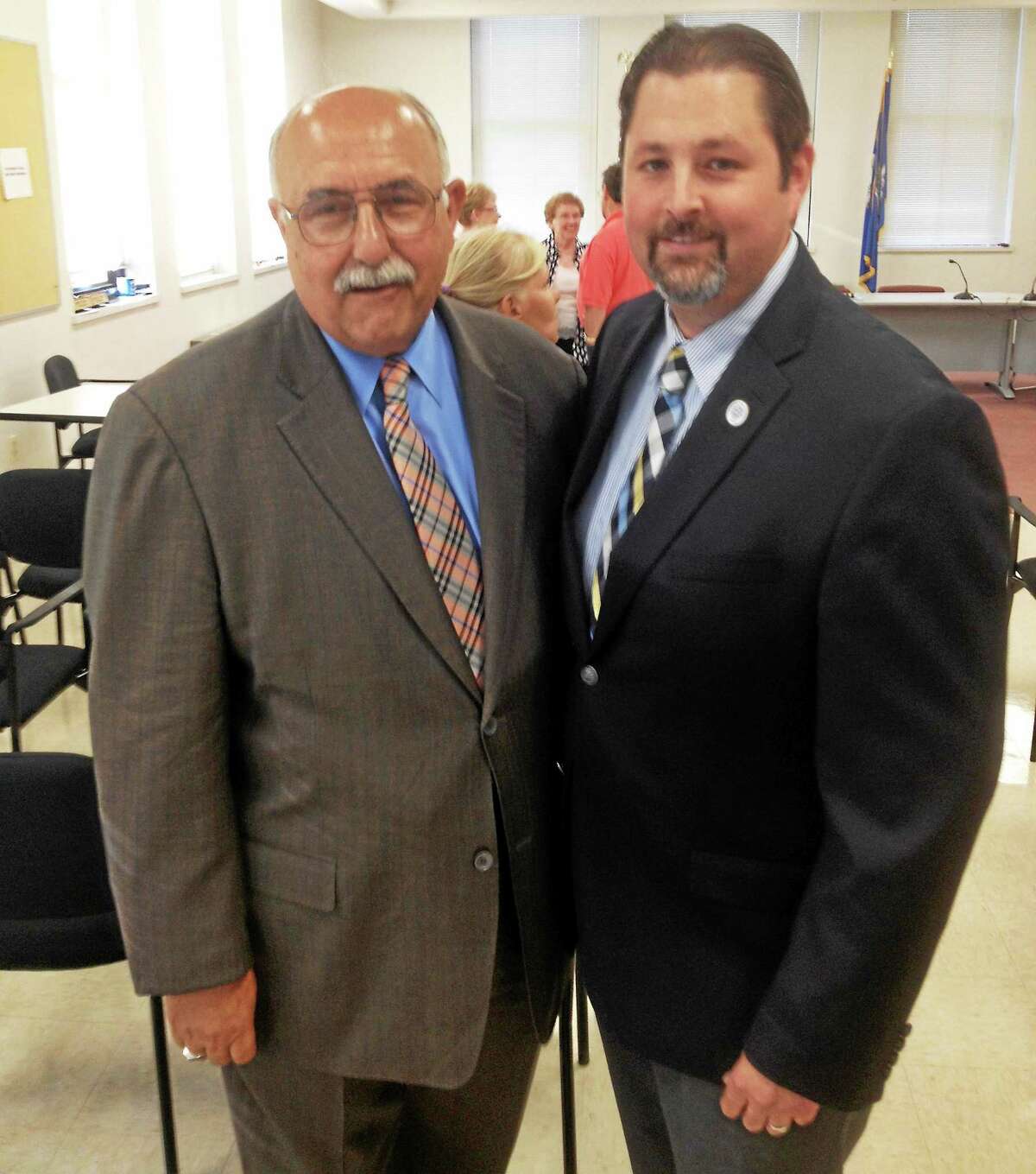 On Monday night, the Town Council voted to hire longtime Cromwell Police Chief Anthony Salvatore, left, as town manager. Here, he stands with Mayor Enzo Faienzo.