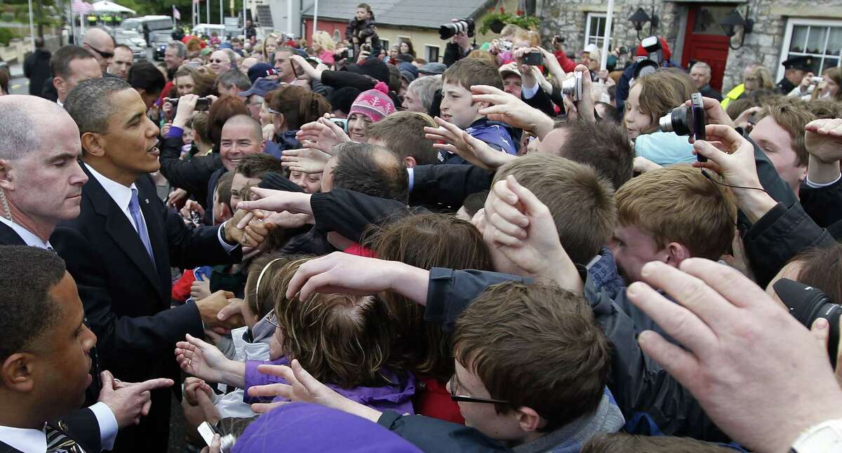 In this May 23, 2011 photo, President Barack Obama greets local residents in Moneygall, Ireland, the ancestral homeland of his great-great-great grandfather. Mark Connolly, the second-in-command on President Barack Obama’s security detail, is at far left. Homeland Security is investigating two senior Secret Service agents accused of crashing a car into a White House security barrier, an agency spokesman says.