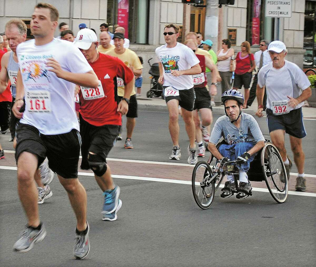 Runners compete in the 2011 Citizens Bank 5K Summer Fun Run on Main Street in Middletown.