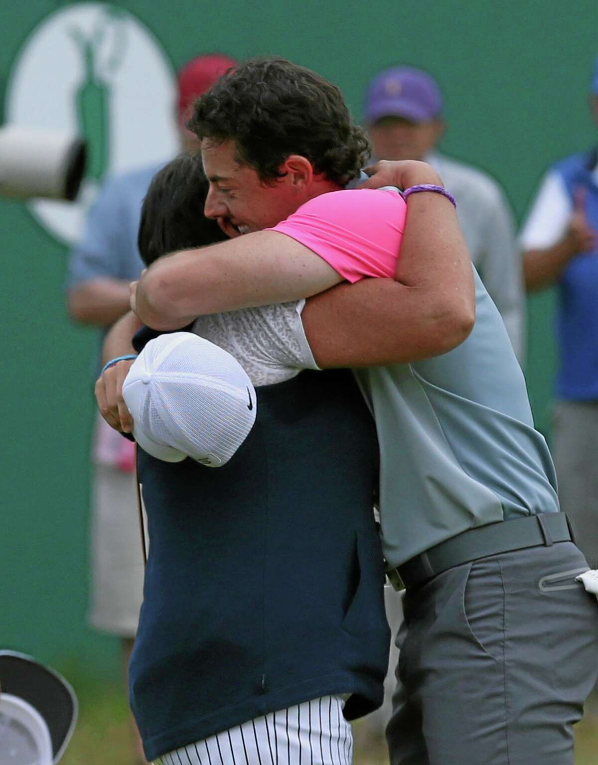 Rory McIlroy hugs his mother Rosie after winning the British Open Sunday.