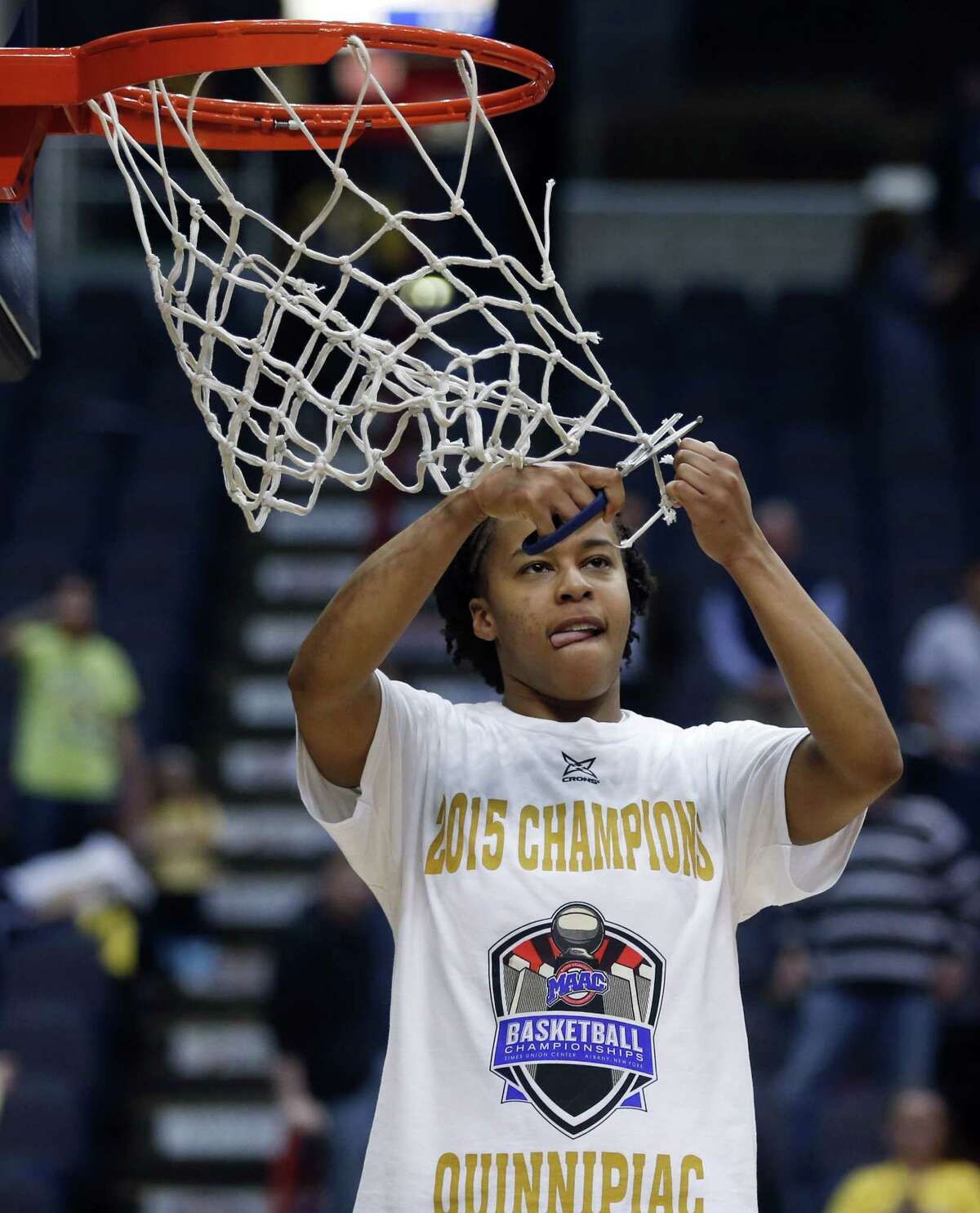 Quinnipiac’s Jasmine Martin cuts the net after the Bobcats’ 72-61 win over Marist in the MAAC tournament championship game on Monday in Albany, N.Y.