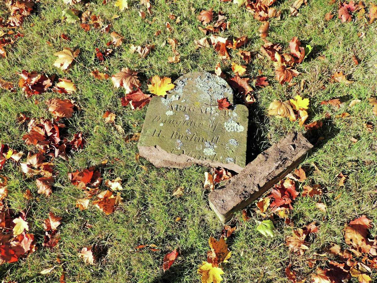 Dozens of headstones were knocked over, damaged and moved this past weekend at the Old Burying Ground Cemetery on Old Clinton Road in Westbrook. Among them was the headstone of Abigail Bushnell, who died at the age of seven months.