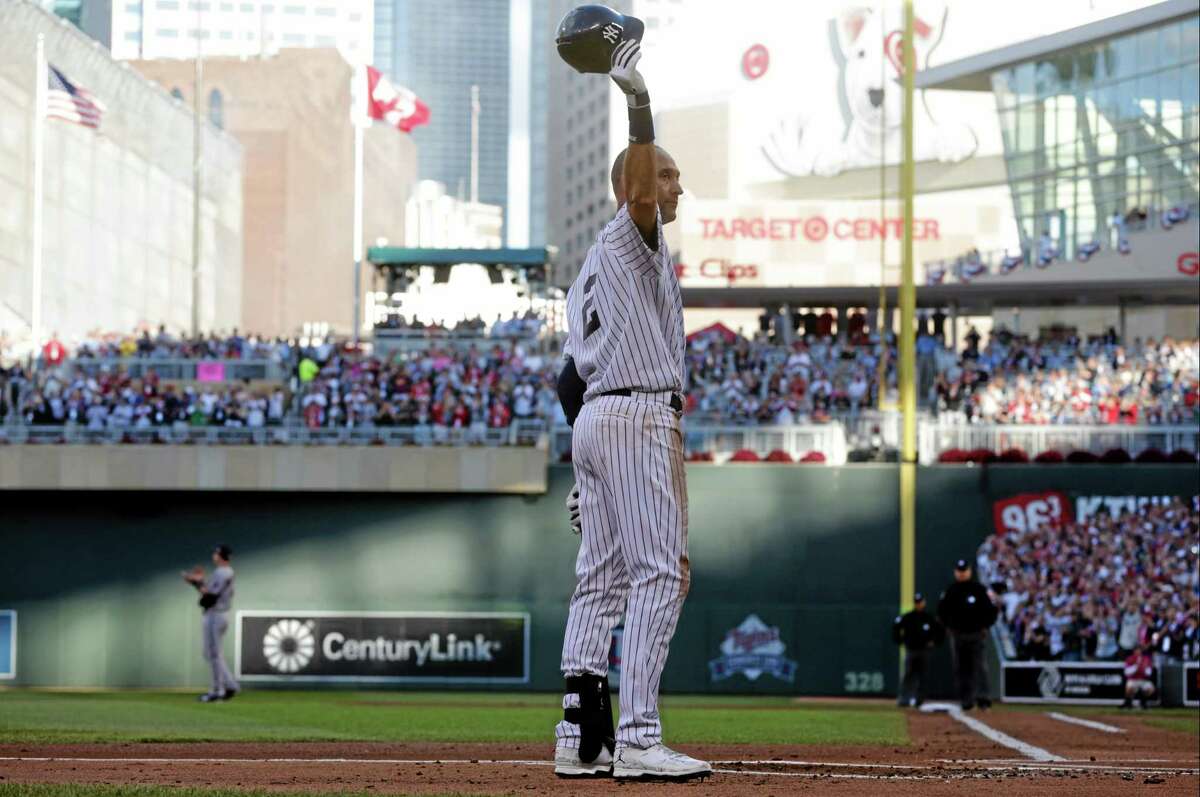 Shortstop Derek Jeter, of the New York Yankees, waves to the crowd during the first inning of the MLB All-Star baseball game, Tuesday, July 15, 2014, in Minneapolis. (AP Photo/Jim Mone)