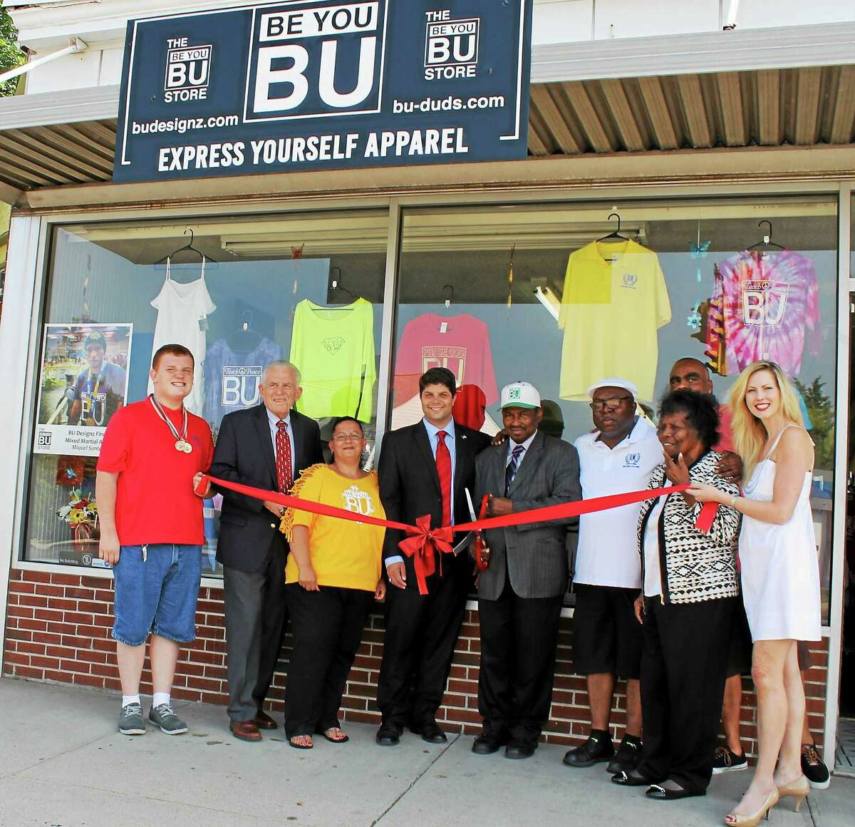 EJ’s Empire and BU Design’s grand opening June 30 on East Main Street, Middletown, was attended by Joey Pizzo, Chamber President Larry McHugh, Joyce Harrell, Mayor Dan Drew, James Young, the Rev. Willie Young, Minister Judy Young and Candace Klaneski.