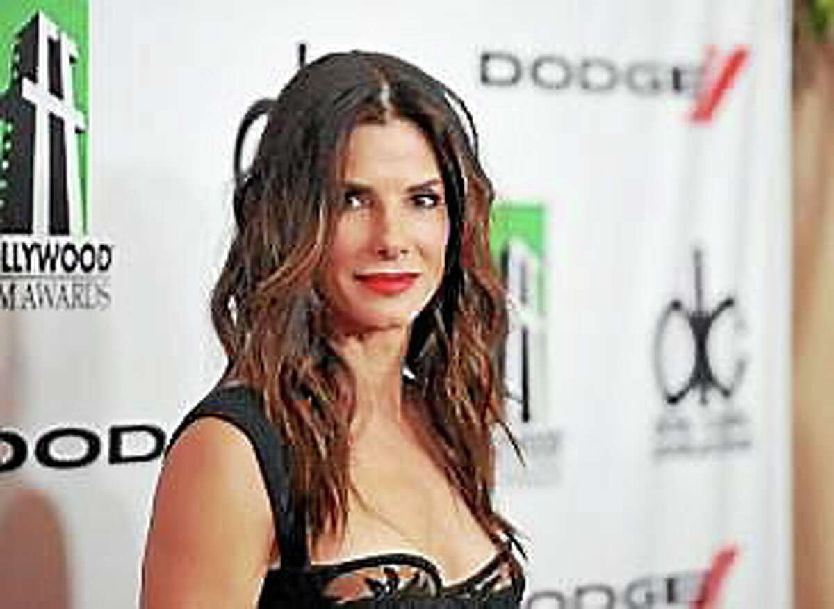 In this Oct. 21, 2013, file photo, Sandra Bullock arrives at the 17th Annual Hollywood Film Awards Gala at the Beverly Hilton Hotel in Beverly Hills, Calif.
