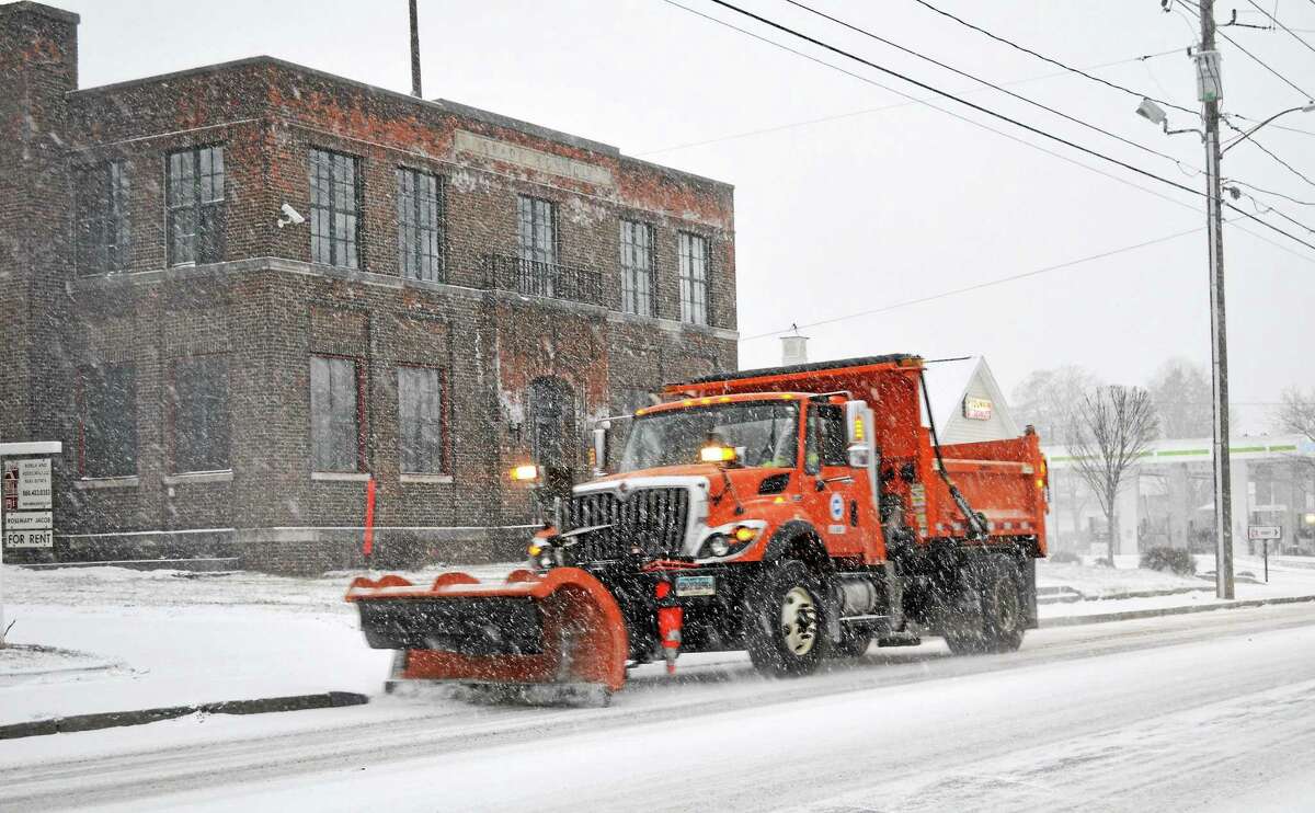 Plows were out in Torrington early during the snow storm Tuesday afternoon. John Berry - The Register Citizen