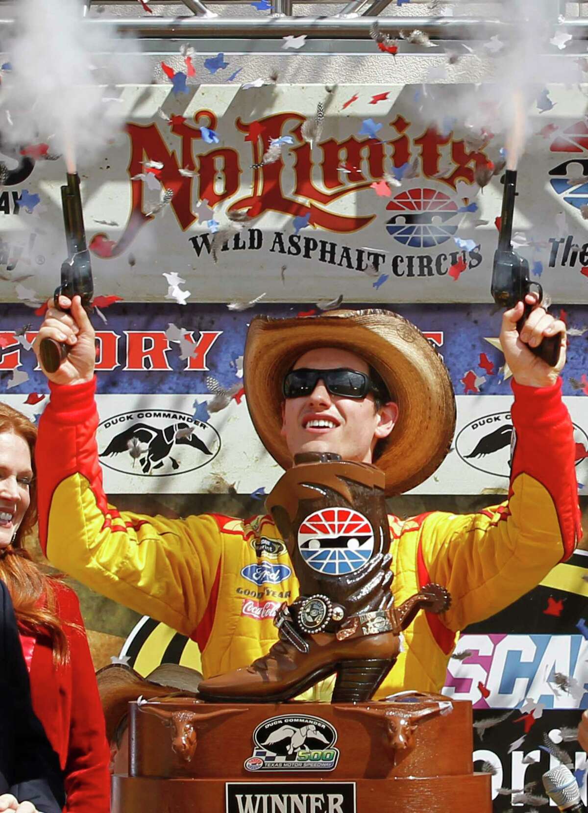 In this April 7, 2014 file photo, Joey Logano shoots off pistols celebrating winning the NASCAR Sprint Cup race at Texas Motor Speedway in Fort Worth.