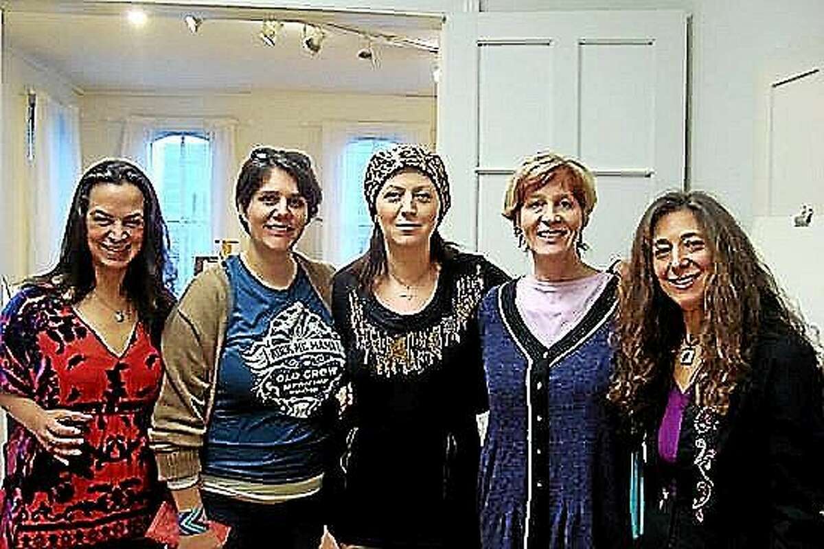 The 2014 International Women’s Day event speakers pose at the Middletown Art Academy (from left) JCherry, Bobby Knoll, Rusa D’Alessandro, Elizabeth McKenty and Dina Abramo Pratt.