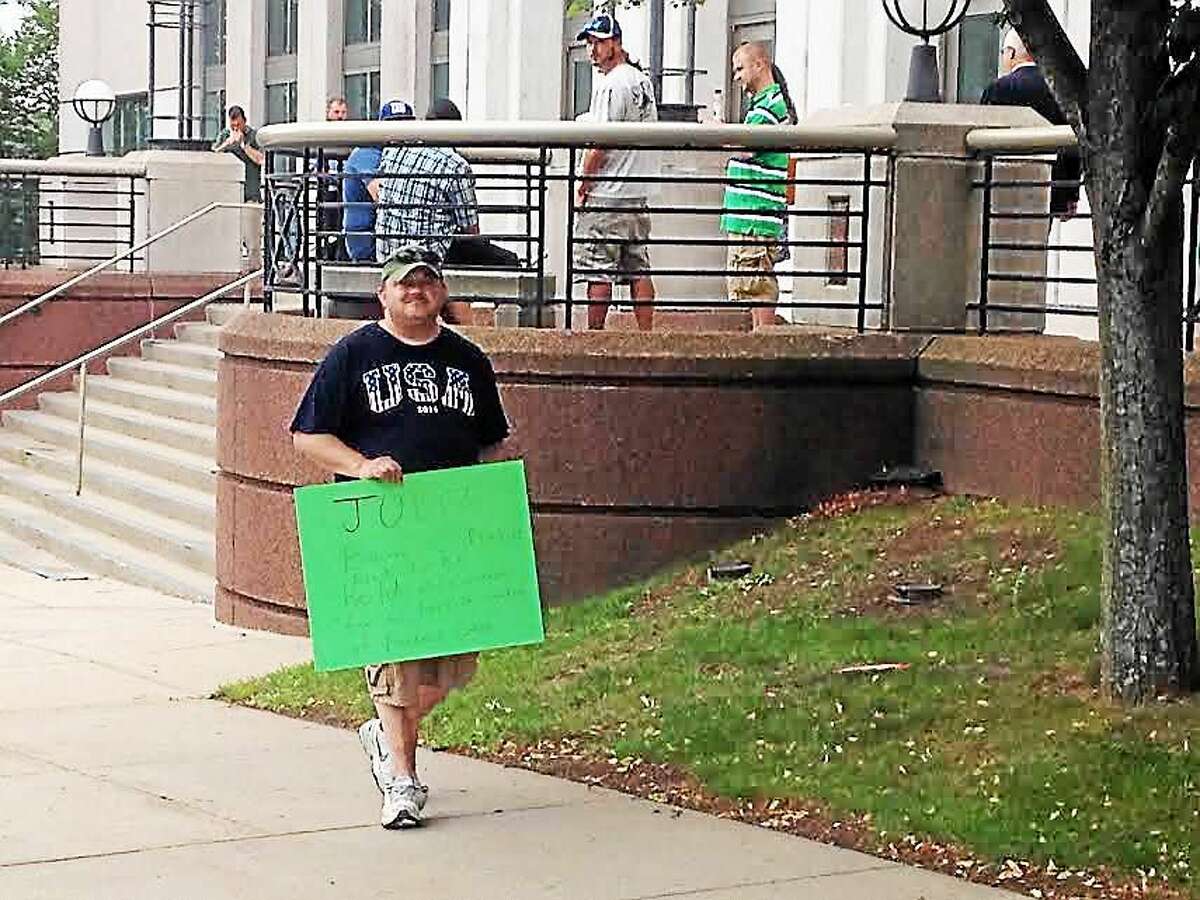 Joe Campbell, 43, protests outside the Middletown Superior Court Thursday morning, as Tony Moreno’s court-appointed public defender was appearing before Judge Gold. Campbell said he wants Judge Barry C. Pinkus held accountable for his ruling in the Aaden Moreno custody case.