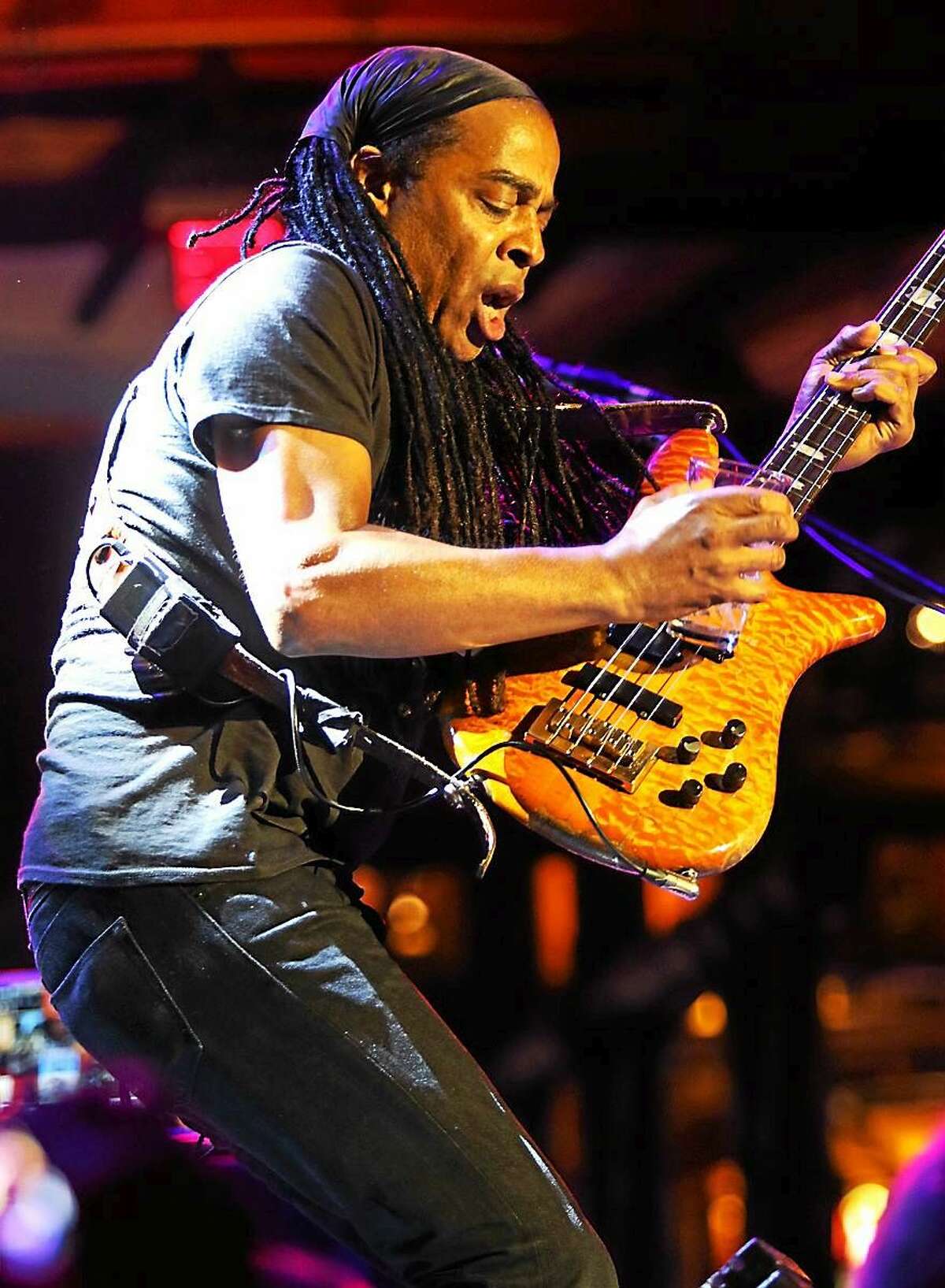Photo by John Atashian Living Colour bassist Doug Wimbish, a Bloomfield native, is shown soloing on stage at the Wolf Den Lounge during the bands concert performance at the Mohegan Sun Casino in Uncasville on Friday July 3. The hard rock band from New York City are on a U.S. tour in support of their brand new CD, ìShade.î