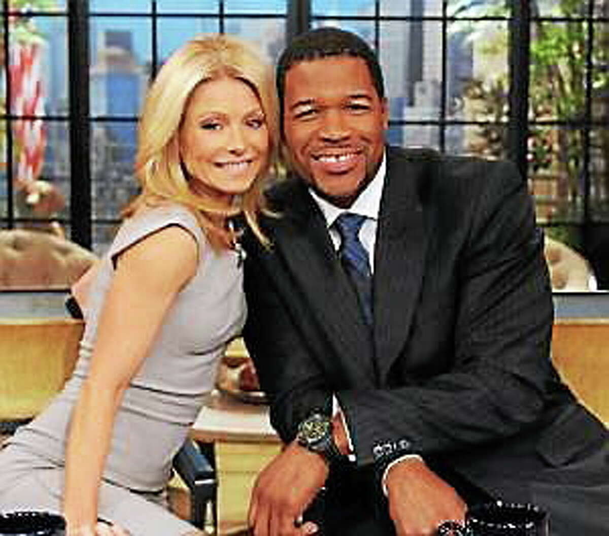 This Feb. 8, 2012, photo shows former football player Michael Strahan, right, and host Kelly Ripa during Strahan’s guest-host appearance on “Live! with Kelly, “ in New York.