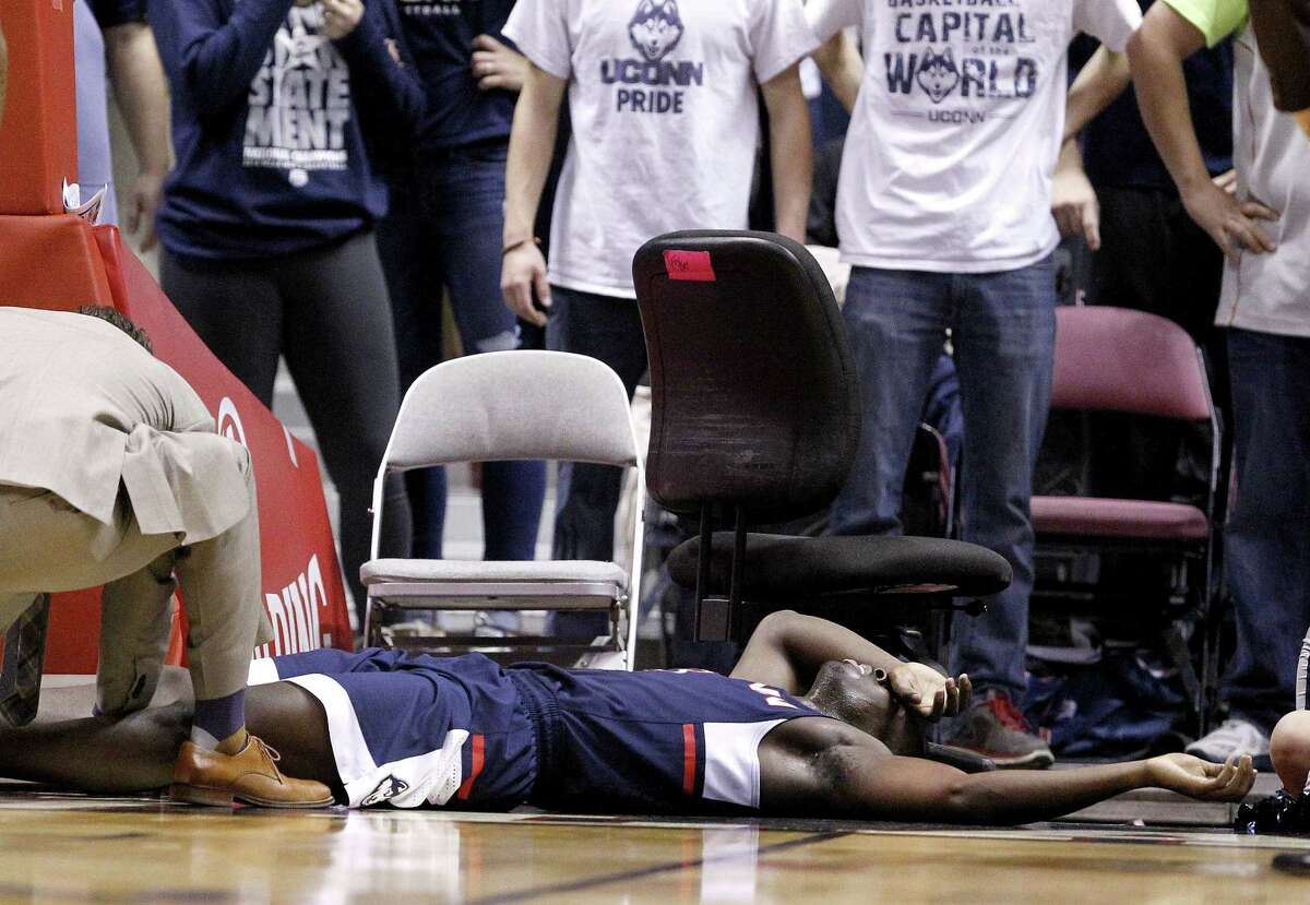 UConn guard Terrence Samuel is attended to by a trainer after suffering an injury against Duke on Thursday.