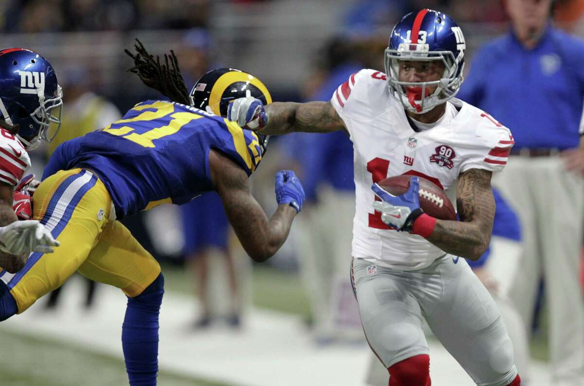 Giants wide receiver Odell Beckham Jr., right, runs with the ball as Rams cornerback Janoris Jenkins defends during the first half Sunday.
