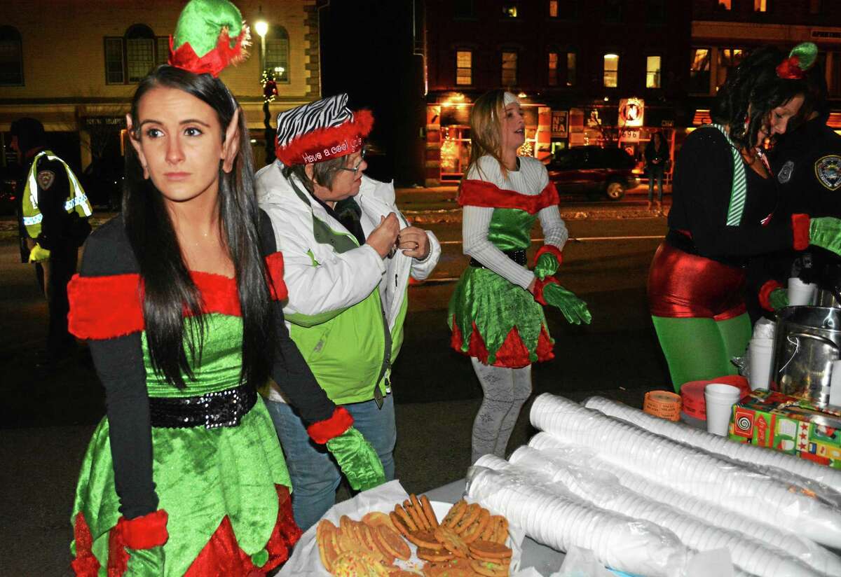 Bitter temperatures didn’t deter large crowds of people from gathering downtown, from the South Green to Eli Cannon’s in the North End, to enjoy hot chocolate, marching bands, visits with Santa, carols and three tree lightings during Middletown’s annual Holiday on Main launch Nov. 28.