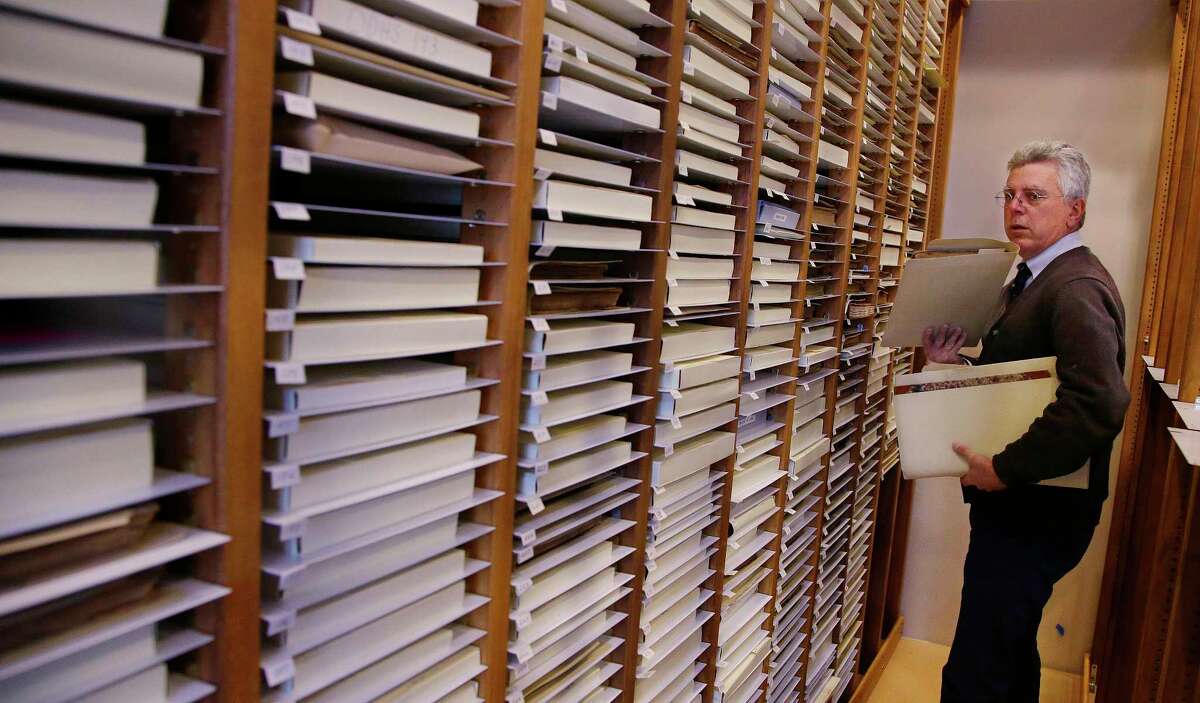 AP Photo/Stephan Savoia In this Tuesday, Dec. 8, 2015, photo, New Bedford Whaling Museum senior maritime historian Michael Dyer combs through the racks of whaling vessel log books in New Bedford, Mass. Maritime historians, climate scientists and ordinary citizens are coming together on a project to study 19th-century whaling ship logbooks to better understand modern-day climate change. The New Bedford Whaling Museum is transcribing and digitizing its logbooks as well as original data sources for this project, called “Old Weather: Whaling.”