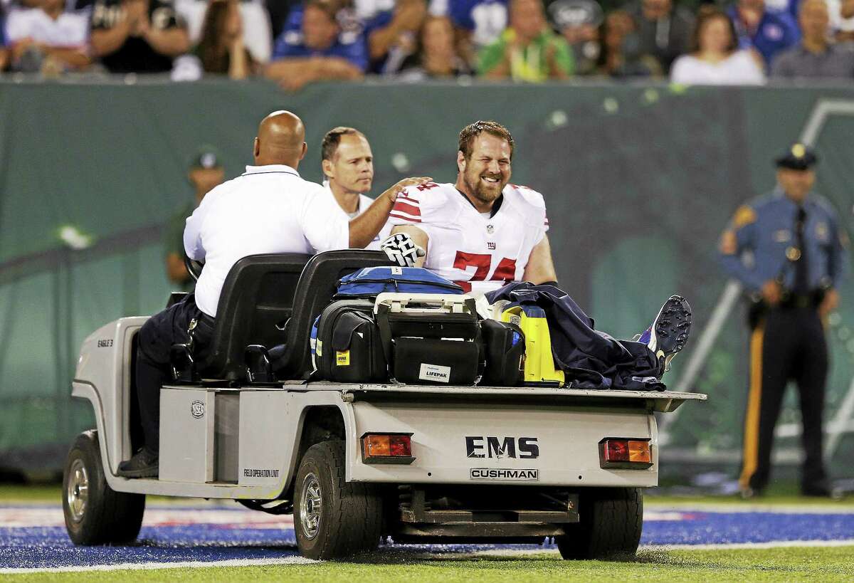 New York Giants guard Geoff Schwartz is carted off the field after suffering an injury to his big toe in the second quarter of a preseason game against the New York Jets on Friday in East Rutherford, N.J.