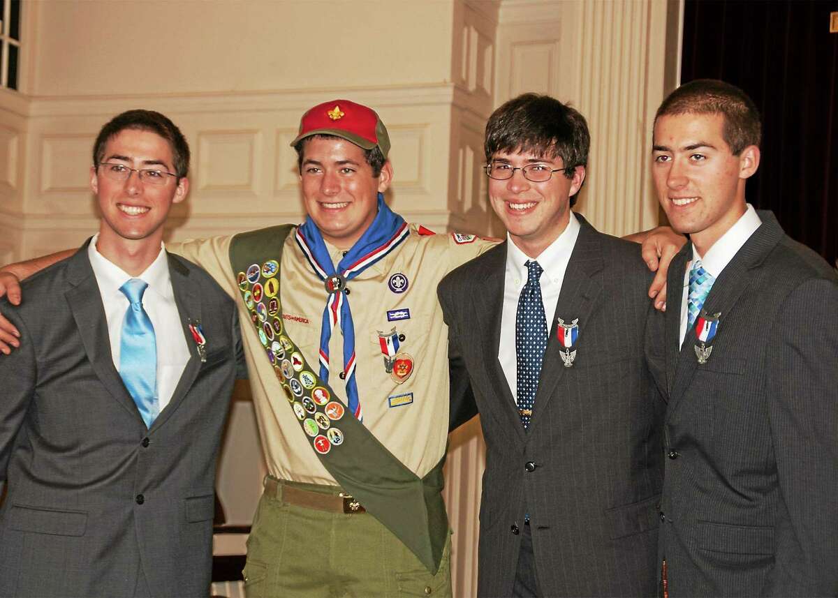 Courtesy Betsy Gates Eli Gates, center, celebrates his Eagle Scout status with brothers Rosse, Caleb and Drew.