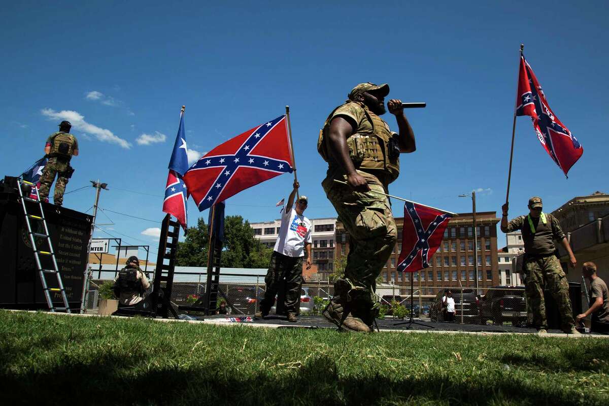 Lamar "Smoke" Russell of the Alamo City Militia performs during a rally opposing the removal of a Confederate monument at Travis Park in San Antonio, Texas on August 12, 2017. Ray Whitehouse / for the San Antonio Express-News