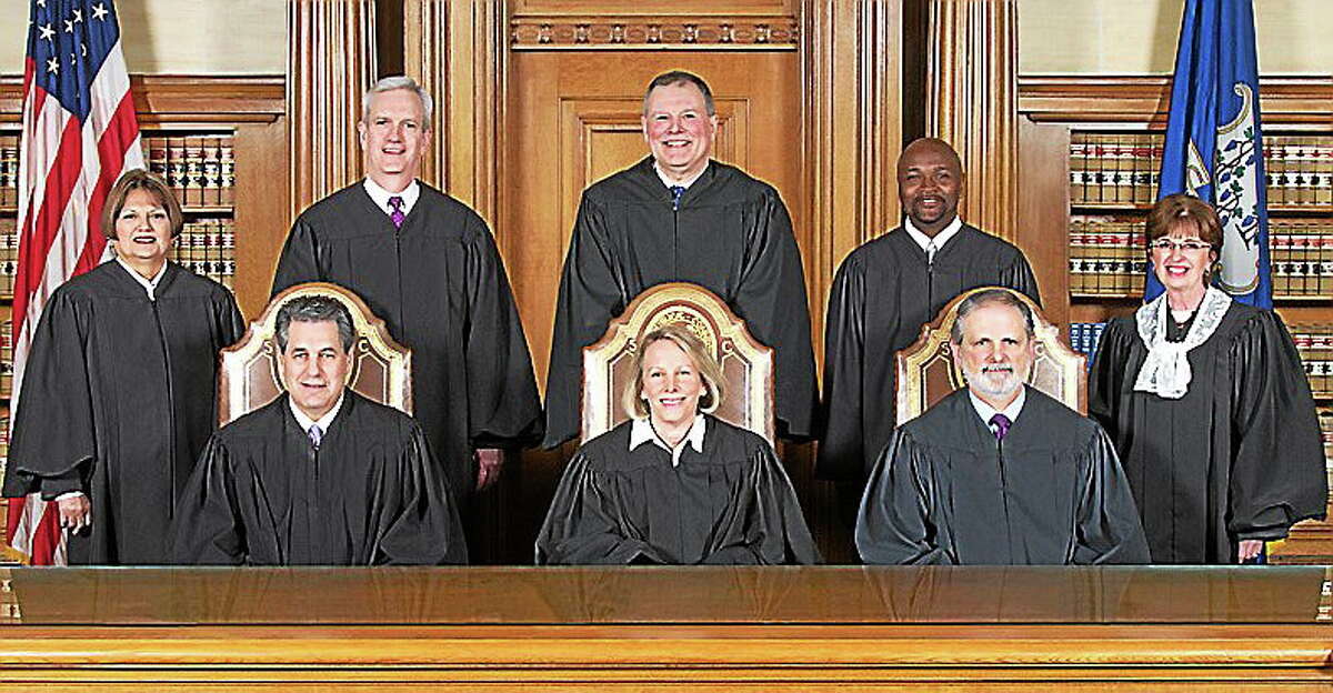 Seated, from left: Justice Richard N. Palmer, Chief Justice Chase T. Rogers, Justice Peter T. Zarella. Standing, from left: Justice Carmen E. Espinosa, Justice Andrew J. McDonald, Justice Dennis G. Eveleigh, Justice Richard A. Robinson, Senior Justice Christine S. Vertefeuille.