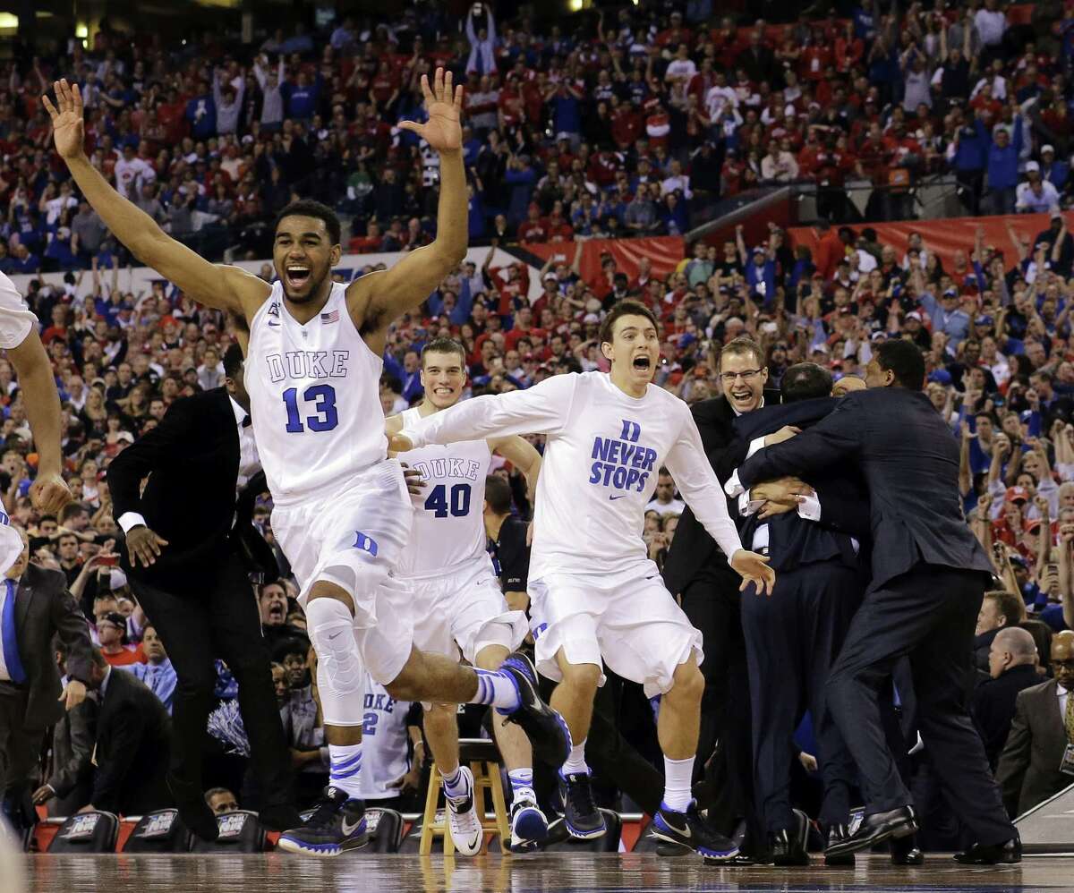 Duke players celebrate after the NCAA Final Four college basketball tournament championship game against Wisconsin Monday, April 6, 2015, in Indianapolis. Duke won 68-63.